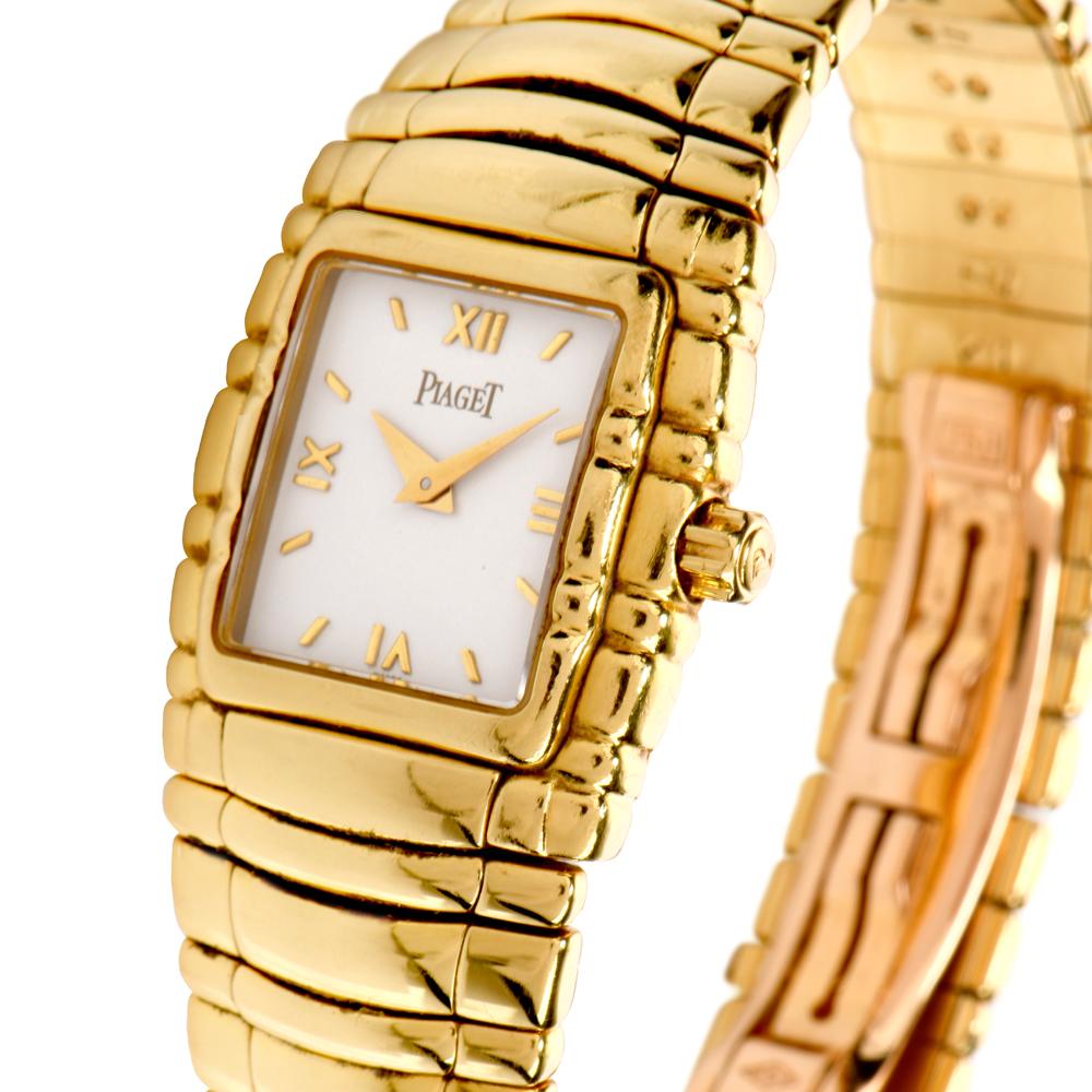 port for casual or dress this Pristine Conditioned  ladies 22mm

Piaget Tanagra, ref. 16051 M 401 D.

This circa 1990 watch is solid 18K yellow gold  and features a white

dial with gold roman numeral markers and dauphine hands.

This watch is