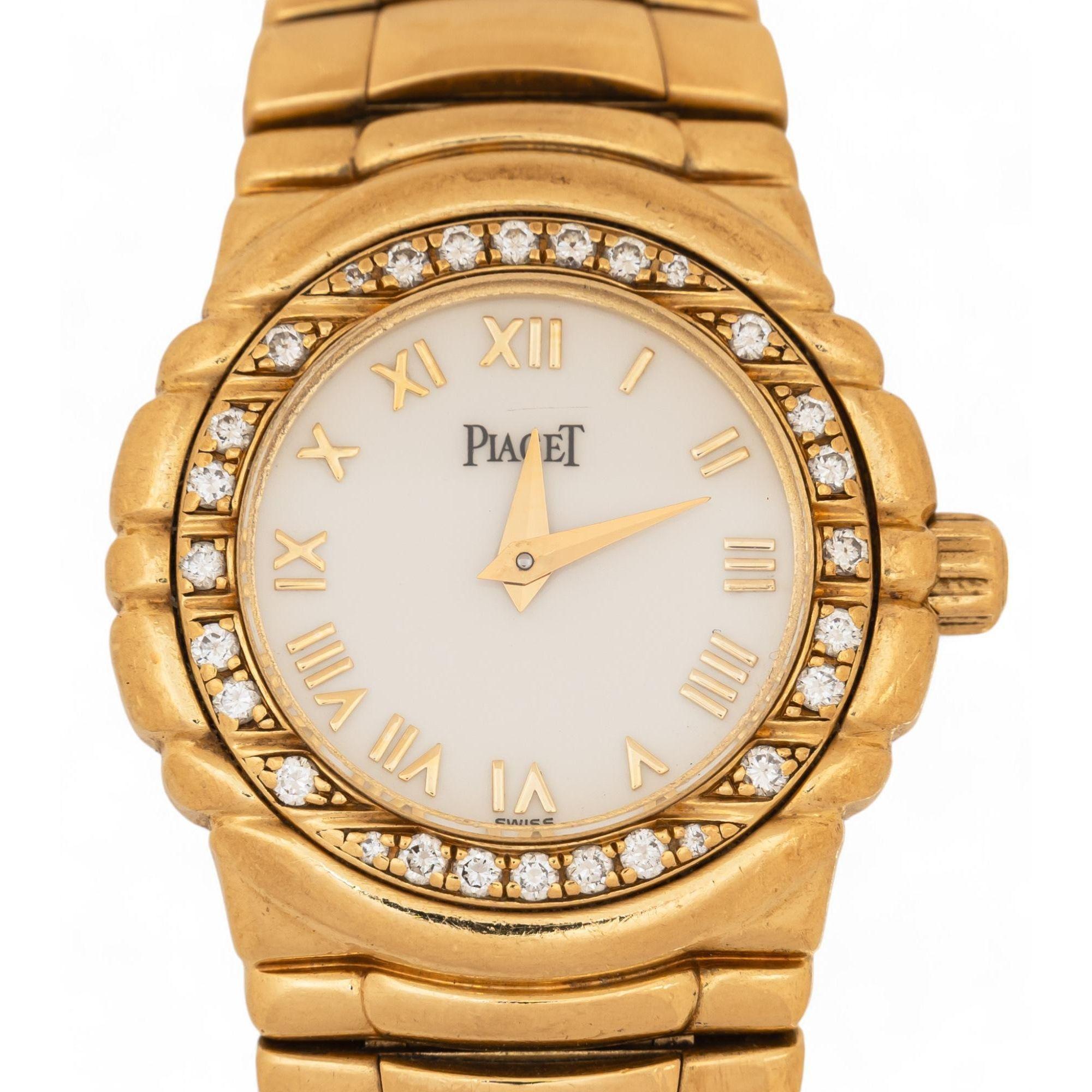 Piaget Tangara Ladies Watch in 18K Yellow Gold. Featuring a diamond bezel, Roman numeral dial, and a sleek 26mm case.

Details:
Item Type: Wrist Watch
Brand: Piaget
Model: Tangara
Metal: 18K Yellow Gold
Total Weight: 89.5 grams
Case Width: