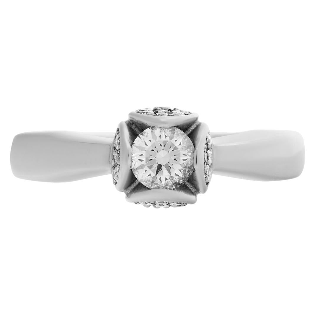 Piaget Tulip ring in 18k white gold with app. 0.35 carat center diamond accented with app. 0.50 carats diamonds Size 4.75 This Piaget ring is currently size 4.75 and some items can be sized up or down, please ask! It weighs 4.4 pennyweights and is