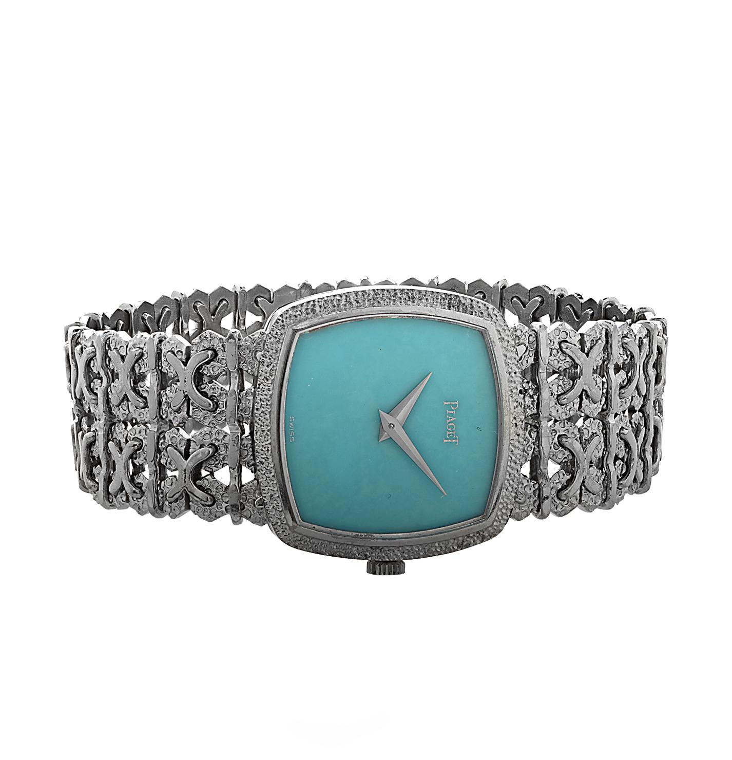Ladies manual wind Piaget watch crafted in 18 karat white gold with a Turquoise dial. The case measures 23 mm and the ornate bracelet measures 6 inches in length. 

Our pieces are all accompanied by an appraisal performed by one of our in-house GIA