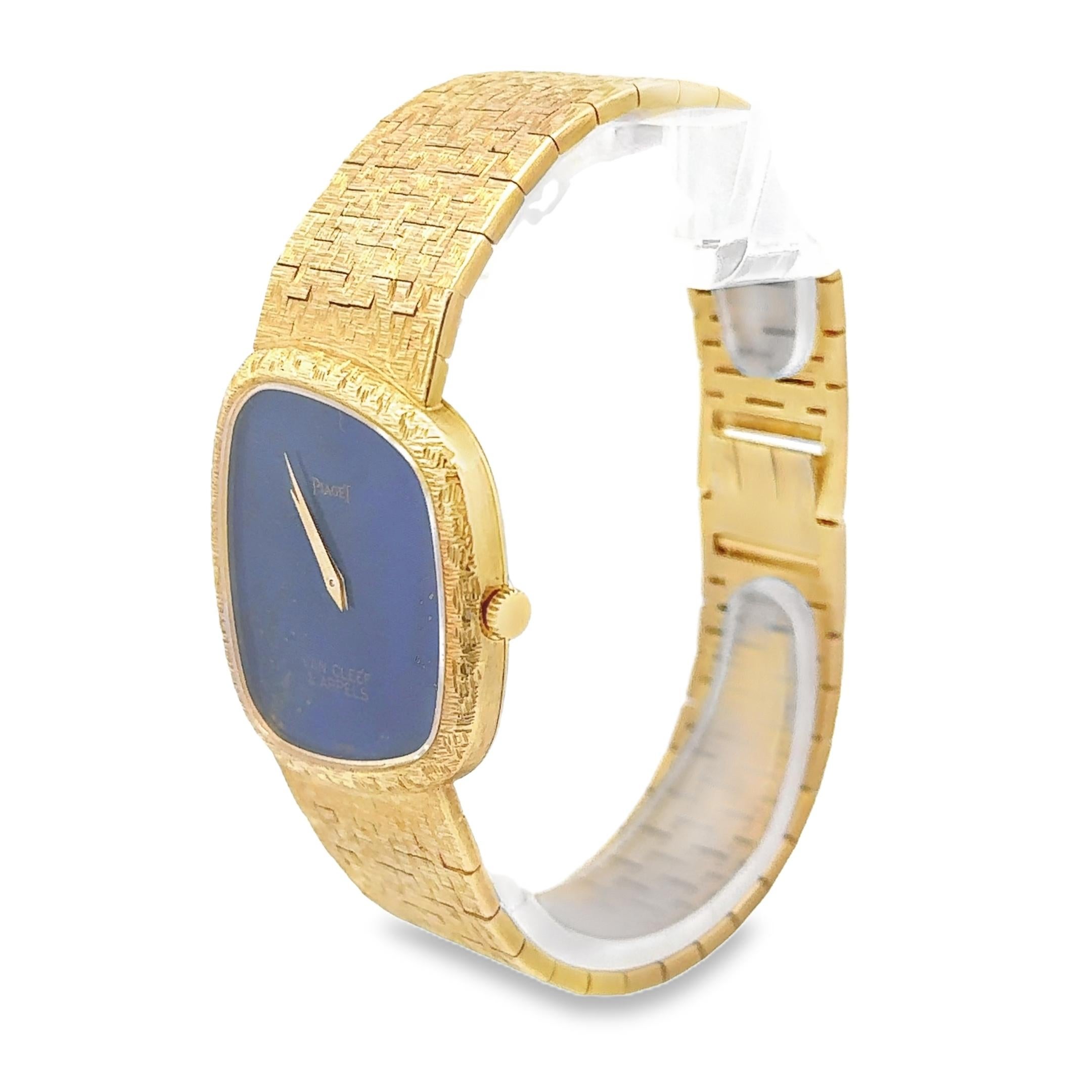 An extraordinary ladies' watch created from the collaboration of Piaget and Van Cleef & Arpels, featuring an asymmetrical bezel with a lapis lazuli dial and a bracelet made of 18K yellow gold with the classic Piaget texture motif. 