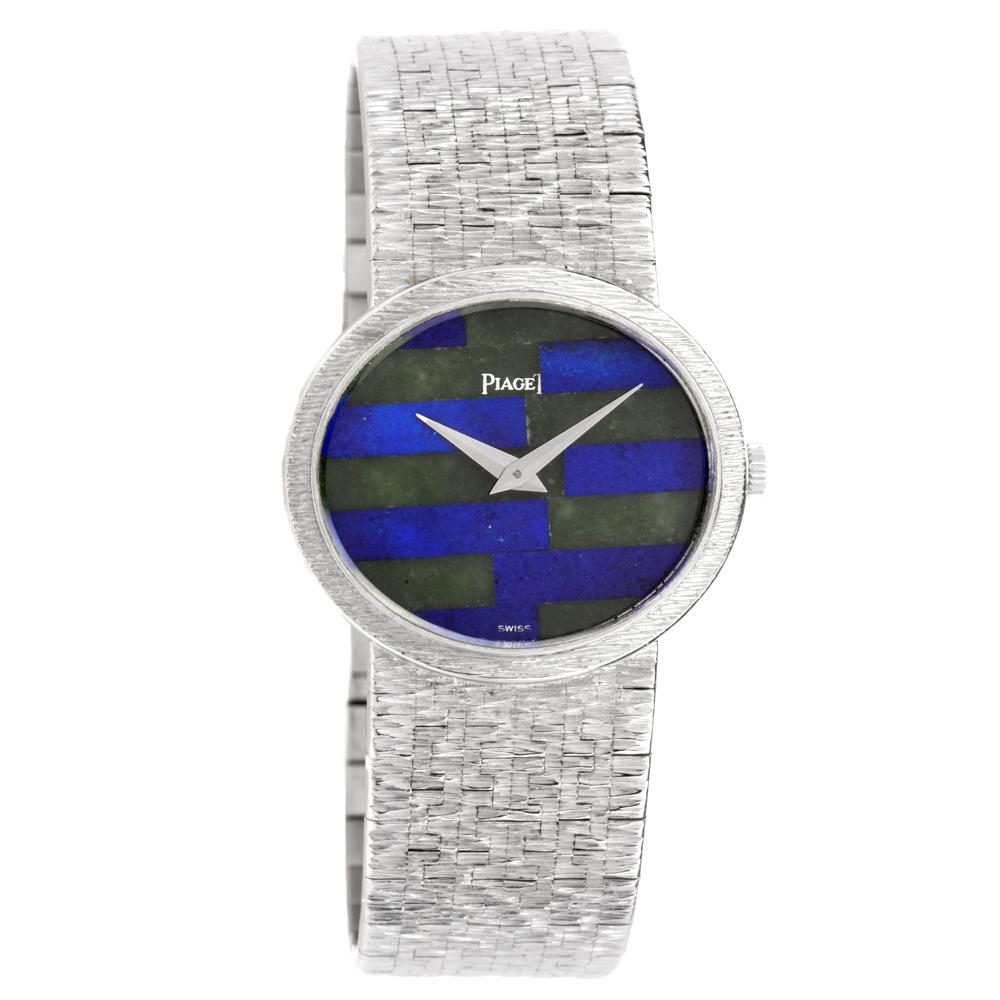 1970's Vintage 18K white gold 27mm Piaget Classique watch featuring a manual movement,
fixed bezel, jadeite and lapis lazuli mosaic dial and integrated bracelet with hinged clasp.
All parts are original piaget, Original esstimated retail price is