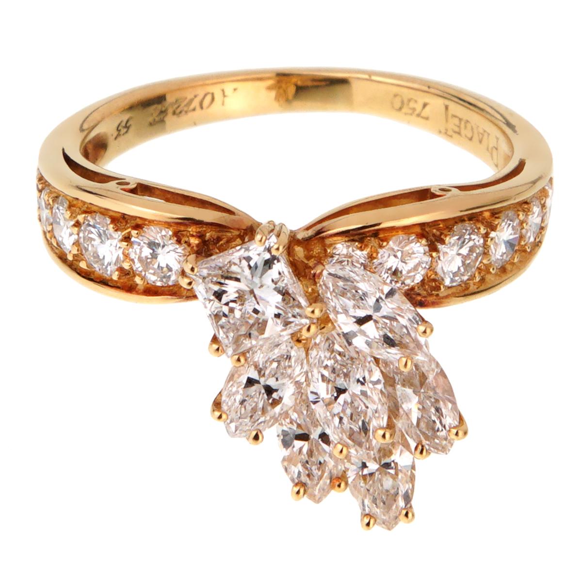 A magnificent Piaget cocktail ring showcasing a fan pattern with round brilliant cut diamonds, marquise cuts, and a single princess cut diamond in 18k yellow gold.

Size 6 1/2 (Resizeable)