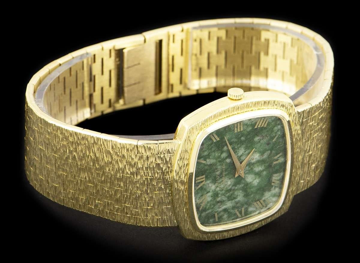 An 18k Yellow Gold Bark Finish Vintage Gents Dress Wristwatch, nephrite jade dial with roman numerals, a fixed 18k yellow gold bark finish bezel, an 18k yellow gold bark finish integrated bracelet with an 18k yellow gold bark finish jewellery style