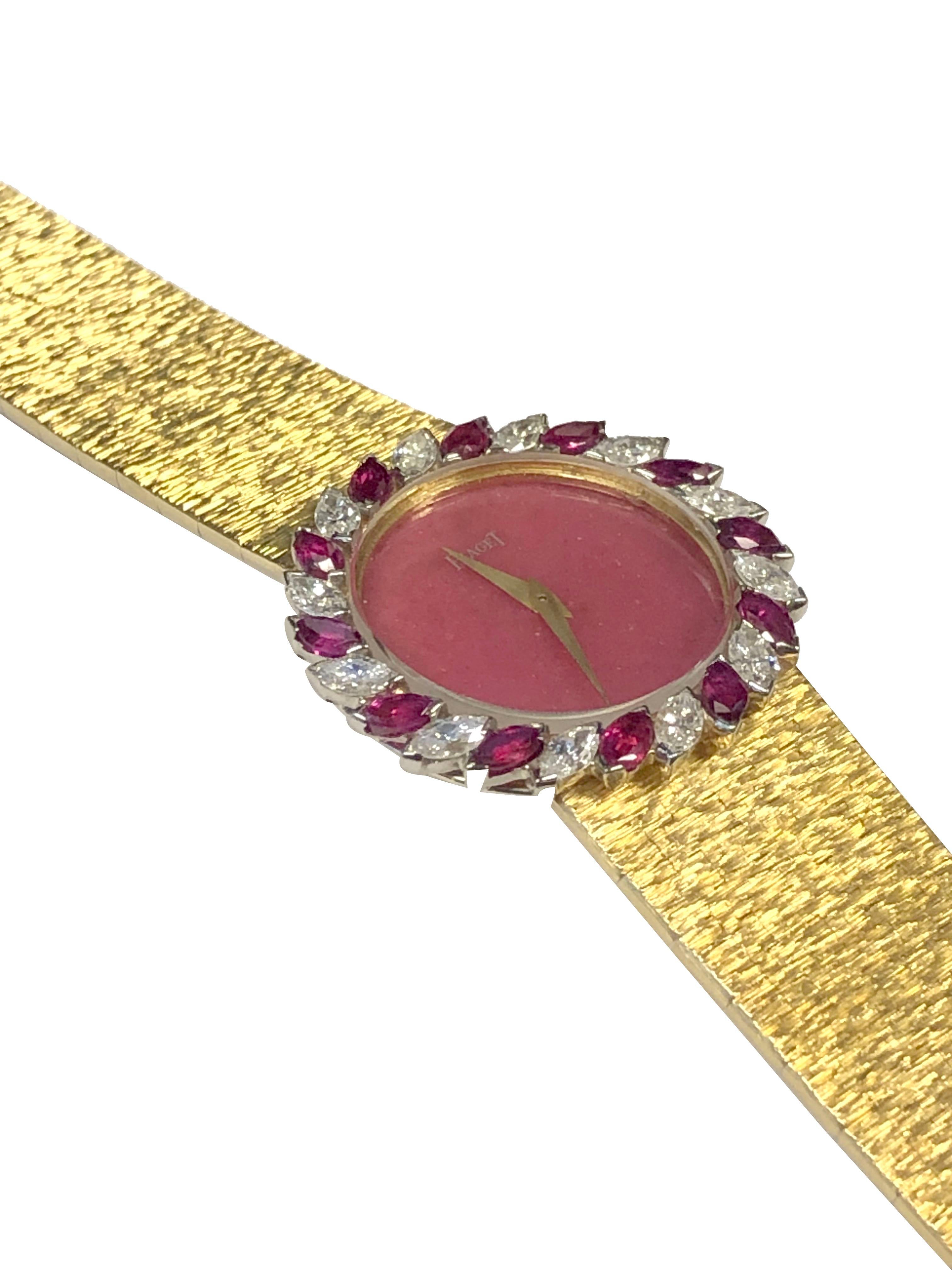 Circa 1980 Piaget Ladies Wrist Watch, 28 M.M 18k Yellow Gold 2 piece case with Marquis shape Diamond and Ruby Bezel, Diamond total approximately 1.25 carat. 17 Jewel Mechanical, Manual wind movement, Rubelite Stone Dial. 5/8 inch wide soft flexible