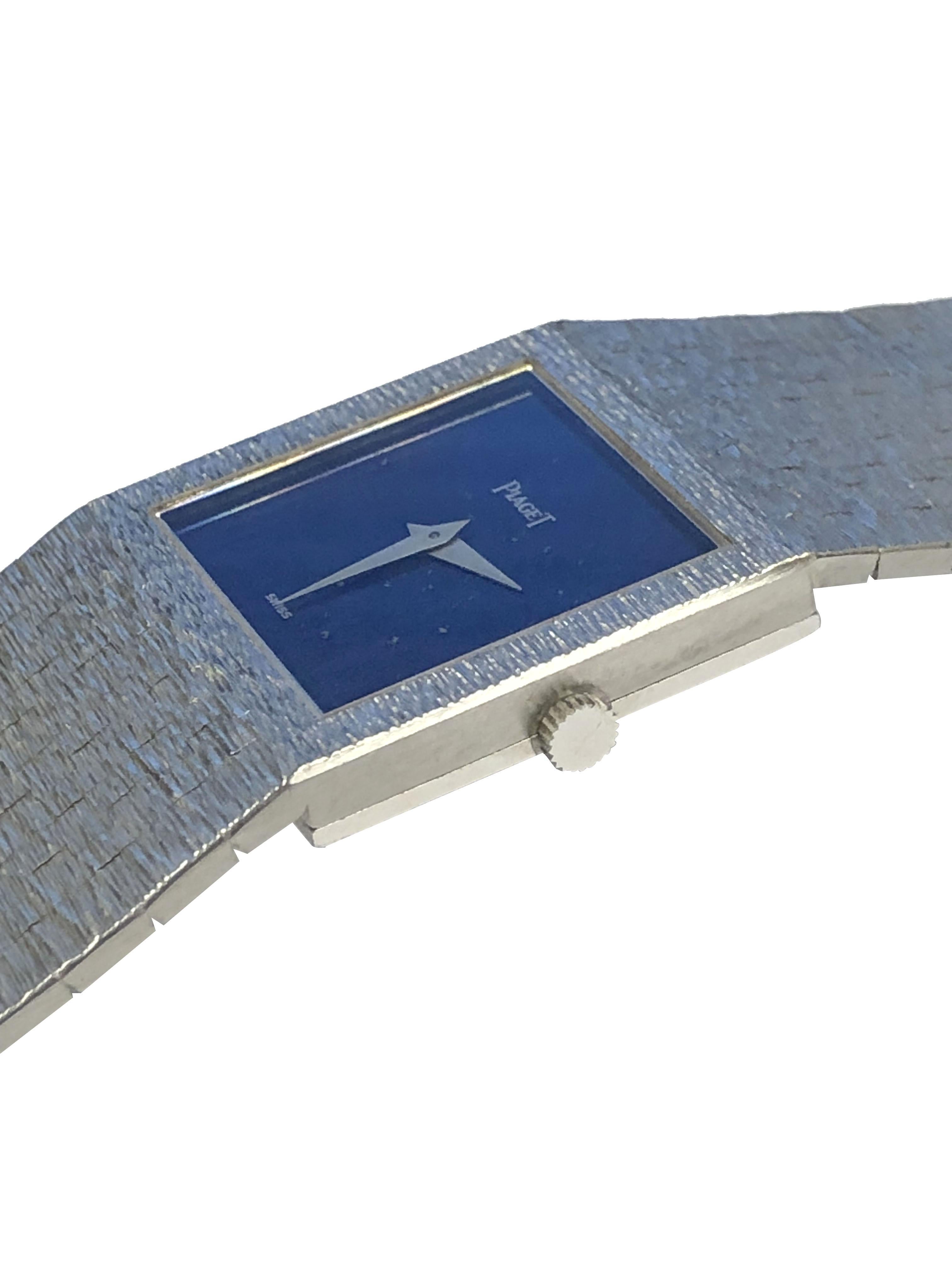 Circa 1980 Piaget Wrist Watch, 23 x 23 M.M. 18k White Gold 2 Piece Case, 17 jewel mechanical, manual wind, nickle lever movement, Lapis Lazuli Stone Dial, white Gold hands. 7/8 inch wide textured link bracelet that is masterfully integrated into the