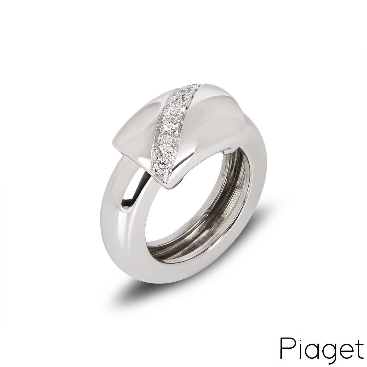 A unique 18k white gold diamond ring by Piaget from the Dancer collection. The ring features a free moving centre with seven round brilliant cut diamonds set diagonally with an approximate weight of 0.30ct, F-G colour and VS-SI clarity. The ring