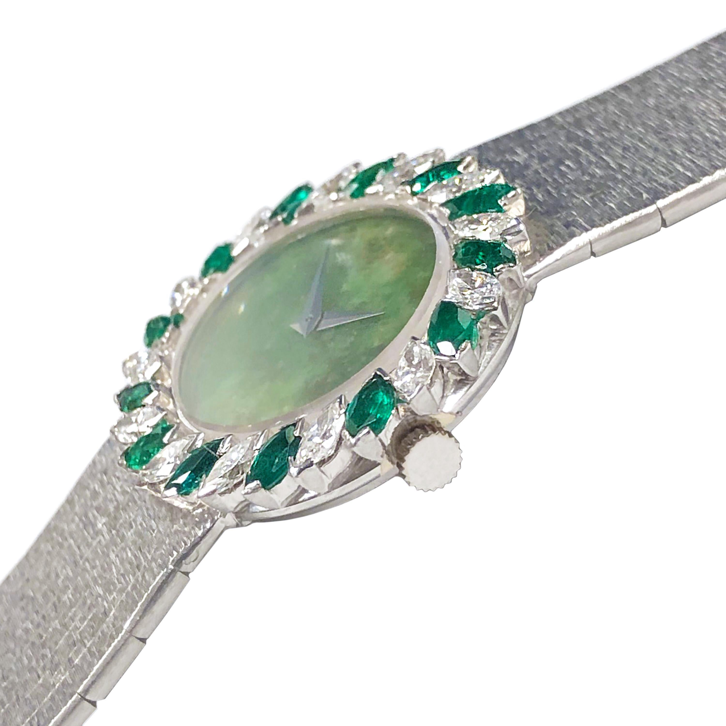 Circa 1980 Piaget Ladies Wrist Watch, 18K White Gold Case measuring 29 X 26 MM. Bezel set with Marquis Diamonds totaling 1.20 Carats and Marquis Emeralds of very fine color. 17 Jewel Mechanical, manual wind movement, Jade Dial. 5/8 inch wide