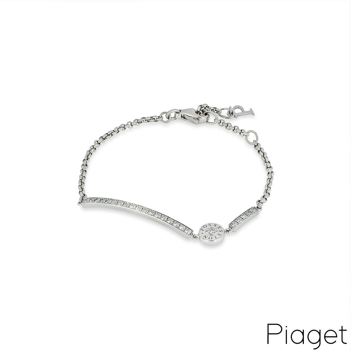 A delicate 18k white gold diamond bracelet by Piaget from the Possession collection. The bracelet comprises of a curved bar set with 18 round brilliant cut diamonds and a second bar set with 5 round brilliant cut diamonds. In between the two is a
