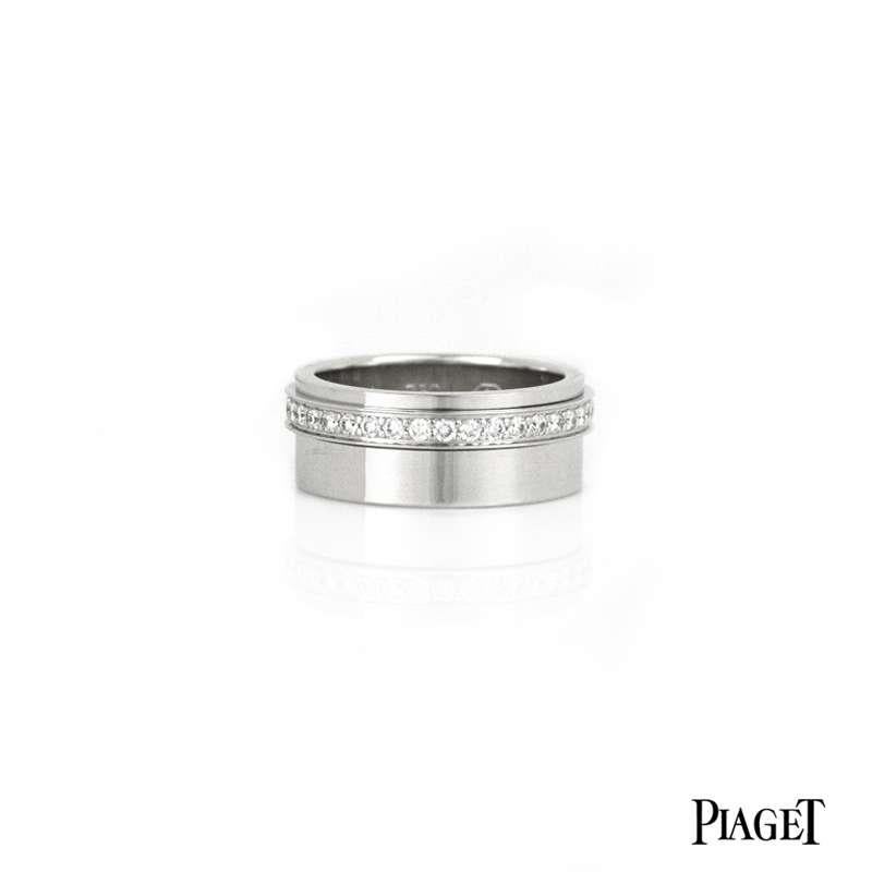 An 18k white gold diamond set ring by Piaget from the Possession collection. The 8mm band is set with a spinning diamond band comprised of 37 diamonds totalling 0.63ct. The ring is a size 55, UK O and has a gross weight of 11.56 grams. 

Comes