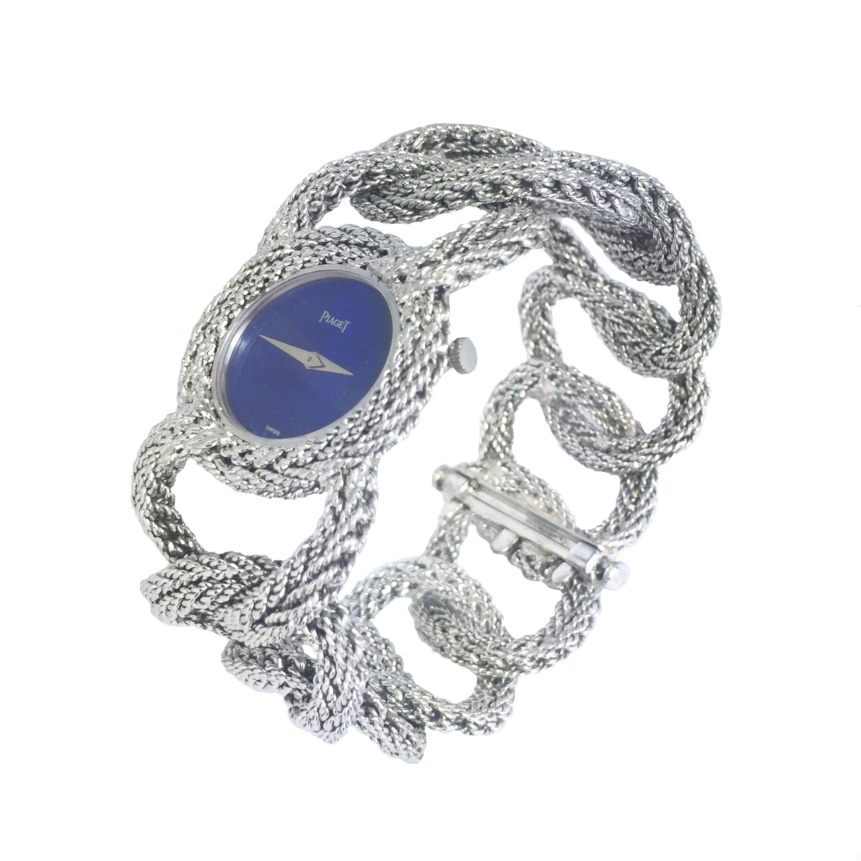 Circa 1970 Piaget 18k White Gold Bracelet Watch, measuring 7 1/2 inches in length and 1 1/4 inches wide. The hand made oval links have a soft textured finish and are very flexible.  17 jewel mechanical, manual wind movement, Lapis Lazuli Dial. 