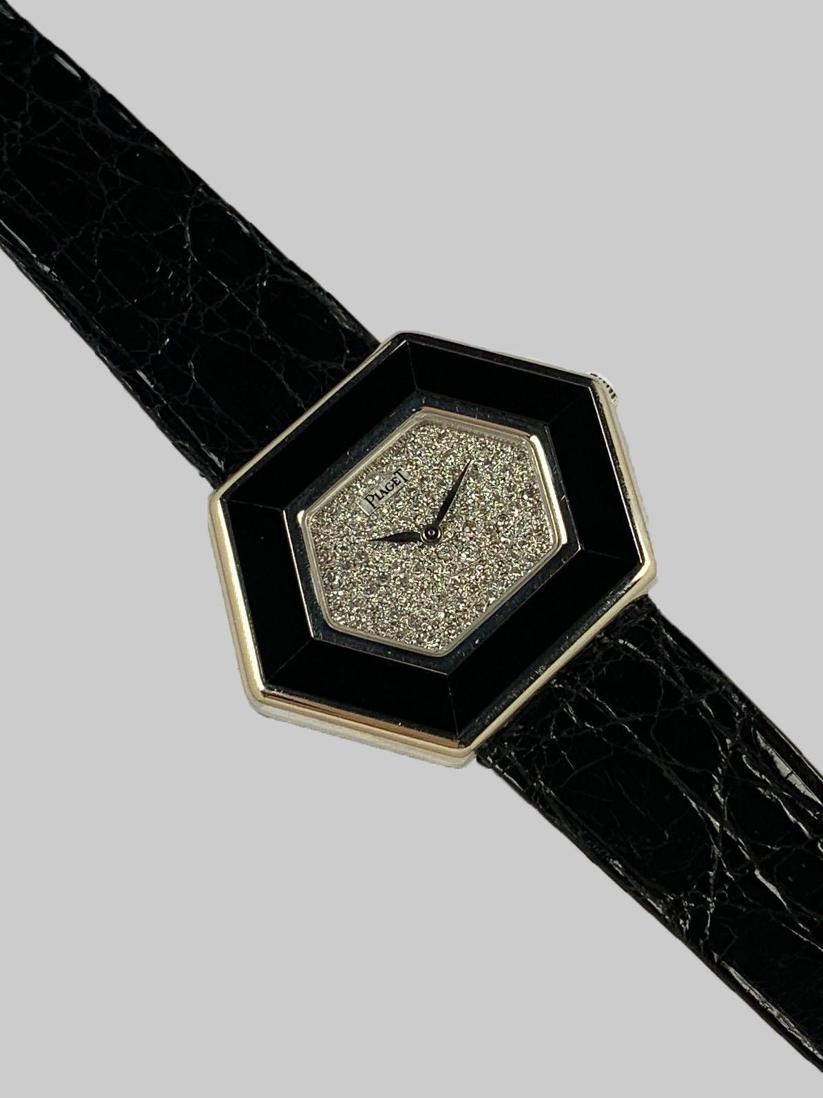 Piaget 18K White Gold Manual Wind Wristwatch
Factory Pave Diamond Dial Accented by Onyx Inlaid Bezel
26mm x 35mm
Piaget Manual Wind Movement
Sapphire Crystal
Comes Fitted on Original Piaget Leather Strap with Piaget 18K White Gold Buckle
Includes