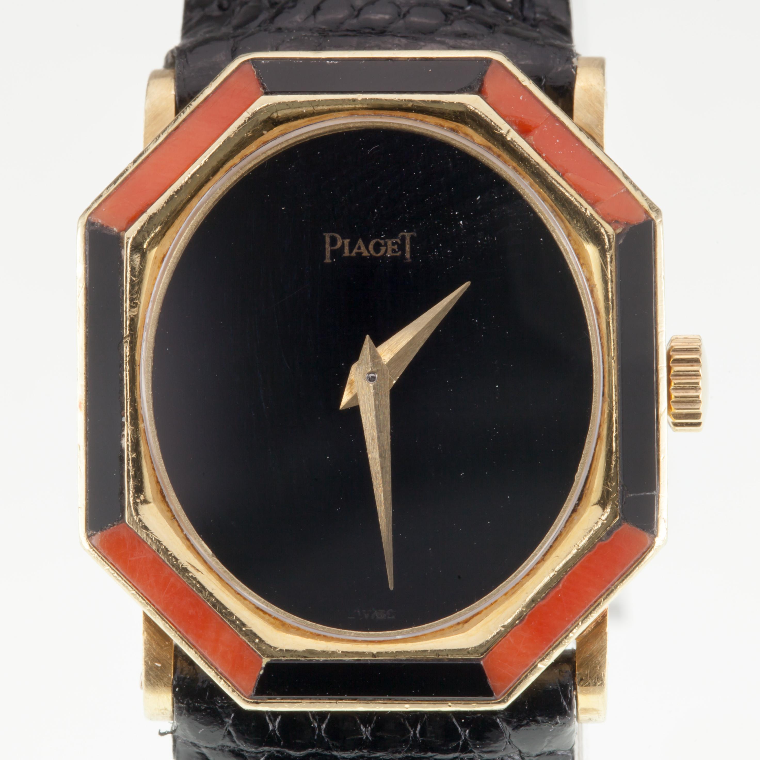 Piaget Women's 18k Yellow Gold Onyx & Coral Women's Mechanical Watch 9341 w/ Box
Model #9341
Serial #227111
18-Jewel Movement #9PI
Movement Serial #7312311
18k Yellow Gold Case w/ Custom-Cut Onyx and Coral-Set Bezel
NOTE: Minor Cracking in Coral on