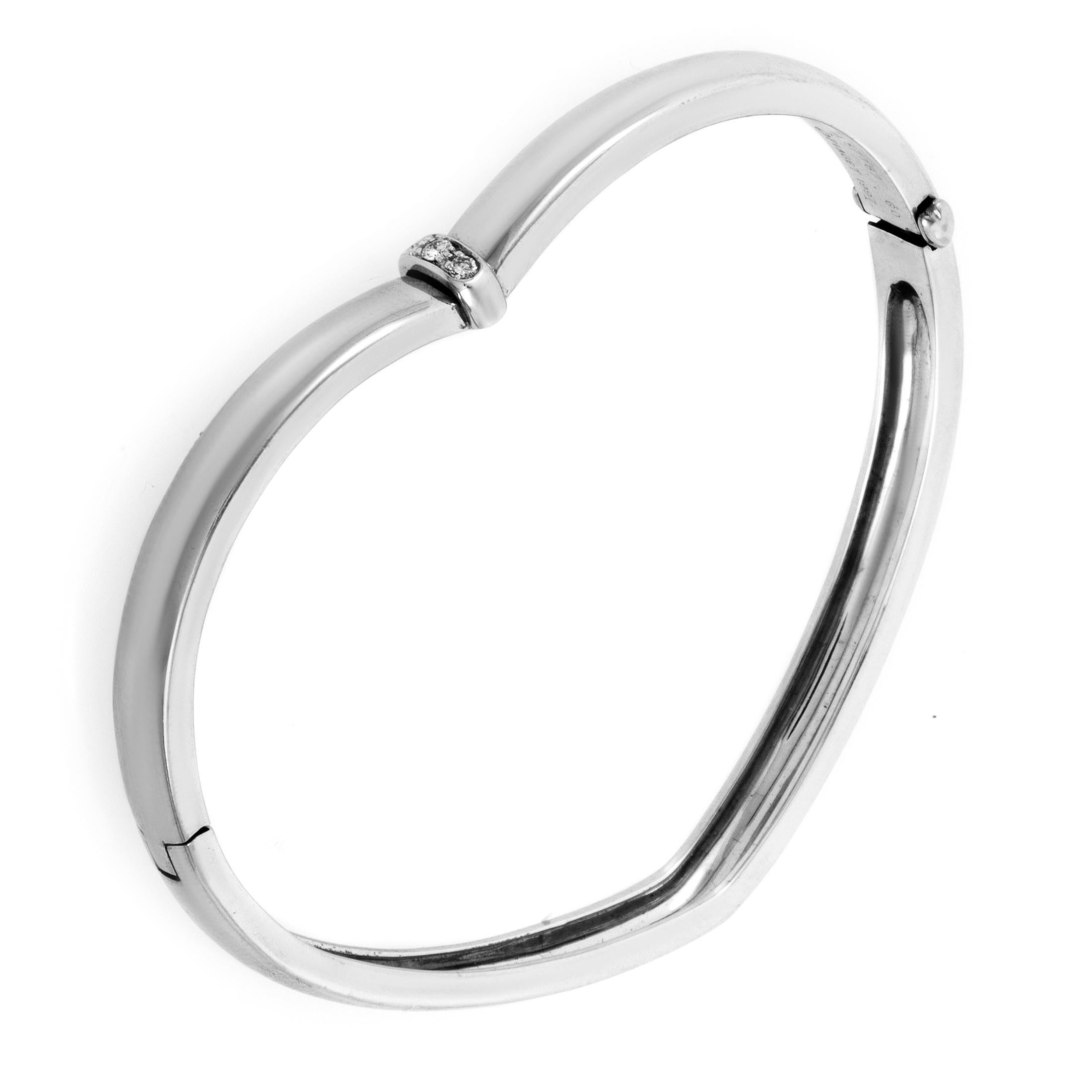 This heart-shaped bracelet from Piaget is the perfect accessory for the one you love. The bracelet is made of 18K white gold and is daintily accented with .10ct of white diamonds.

