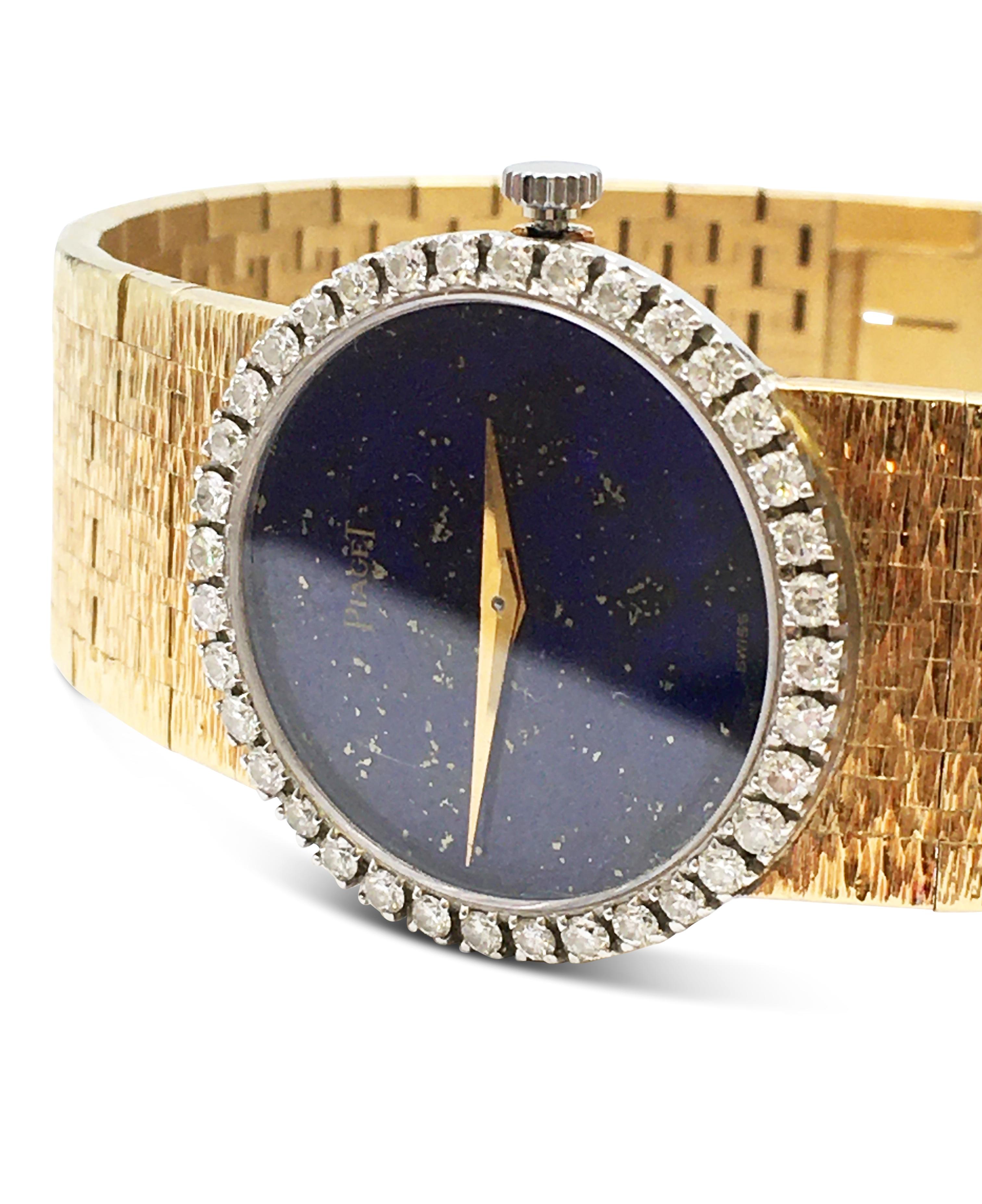 Authentic Piaget ladies watch made in 18 karat yellow gold with a stunning round lapis de lazuli dial. Watch case is an elegant 24mm and the bezel is set with an estimated 0.72 carats of round brilliant cut diamonds (F-G in color, VS clarity). This