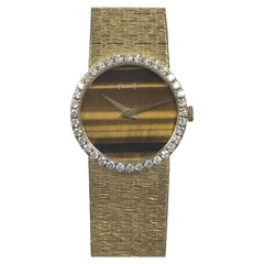 Piaget Mechanische Armbanduhr, Gelbgold Diamant-Lünette und Tigerauge