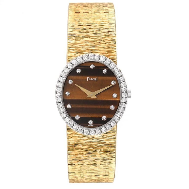 Piaget Yellow Gold Diamond Tiger Eye Vintage Cocktail Ladies Watch 9826. Manual winding movement. 18k yellow gold oval case 27.0 x 24.0 mm. 18k yellow gold original Piaget factory diamond bezel. Mineral glass crystal. Tiger eye dial with 18K yellow