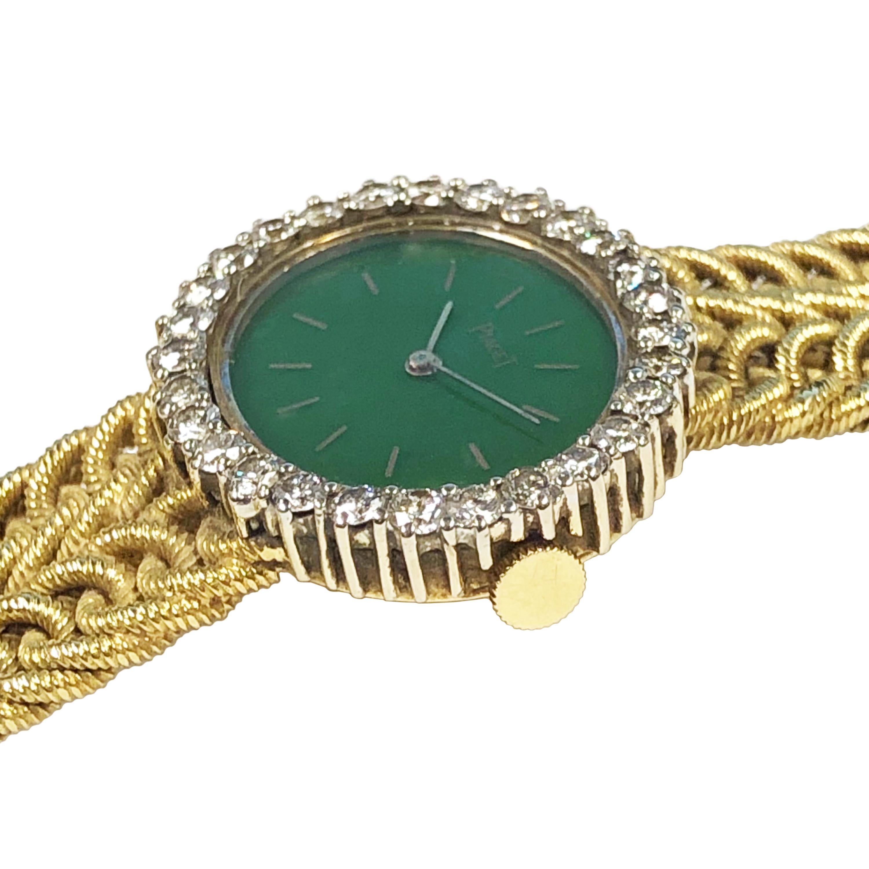 Circa 1980 Piaget ladies Wrist Watch, 28 X 24 M.M. 2 piece case. Factory set bezel of Fine White Round Brilliant cut Diamonds totaling 1.20 Carats. Jadite stone dial. 1/2 inch wide textured integrated links bracelet, watch length 6 1/4 inches. 