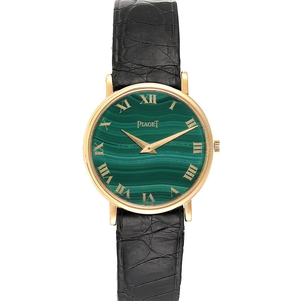 Piaget Yellow Gold Malachite Dial Vintage Ladies Watch 9015. Manual-winding movement. 18k yellow gold slim case 22.0 mm in diameter. 18K yellow gold bezel. Mineral glass crystal. Malachite dial with gold roman numerals. Black leather strap with 18k