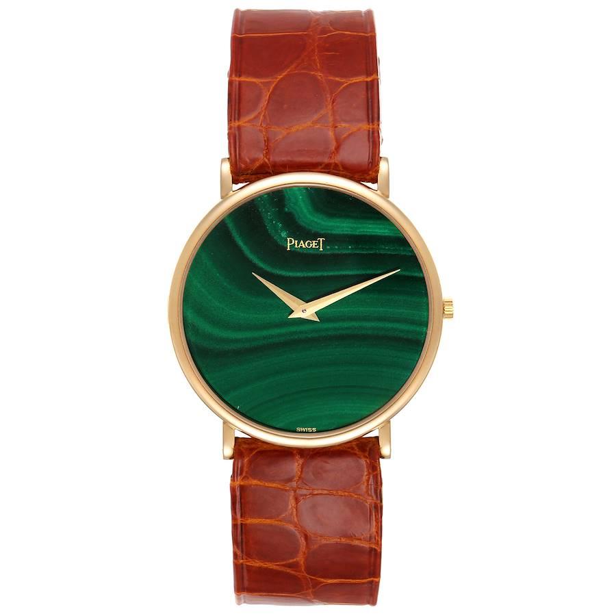 Piaget Yellow Gold Malachite Dial Vintage Mens Watch 9035. Manual winding movement. 18k yellow gold slim case 32.0 mm in diameter. . Mineral glass crystal. Malachite dial with gold roman numerals. Brown leather strap with 18k yellow gold tang