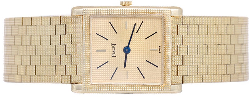 Piaget 18k yellow gold dress watch with manual-wind movement. Gilt dial with black baton markers. 18k yellow gold mesh bracelet (will fit apx. 7-in. wrist). Pre-owned with custom box.