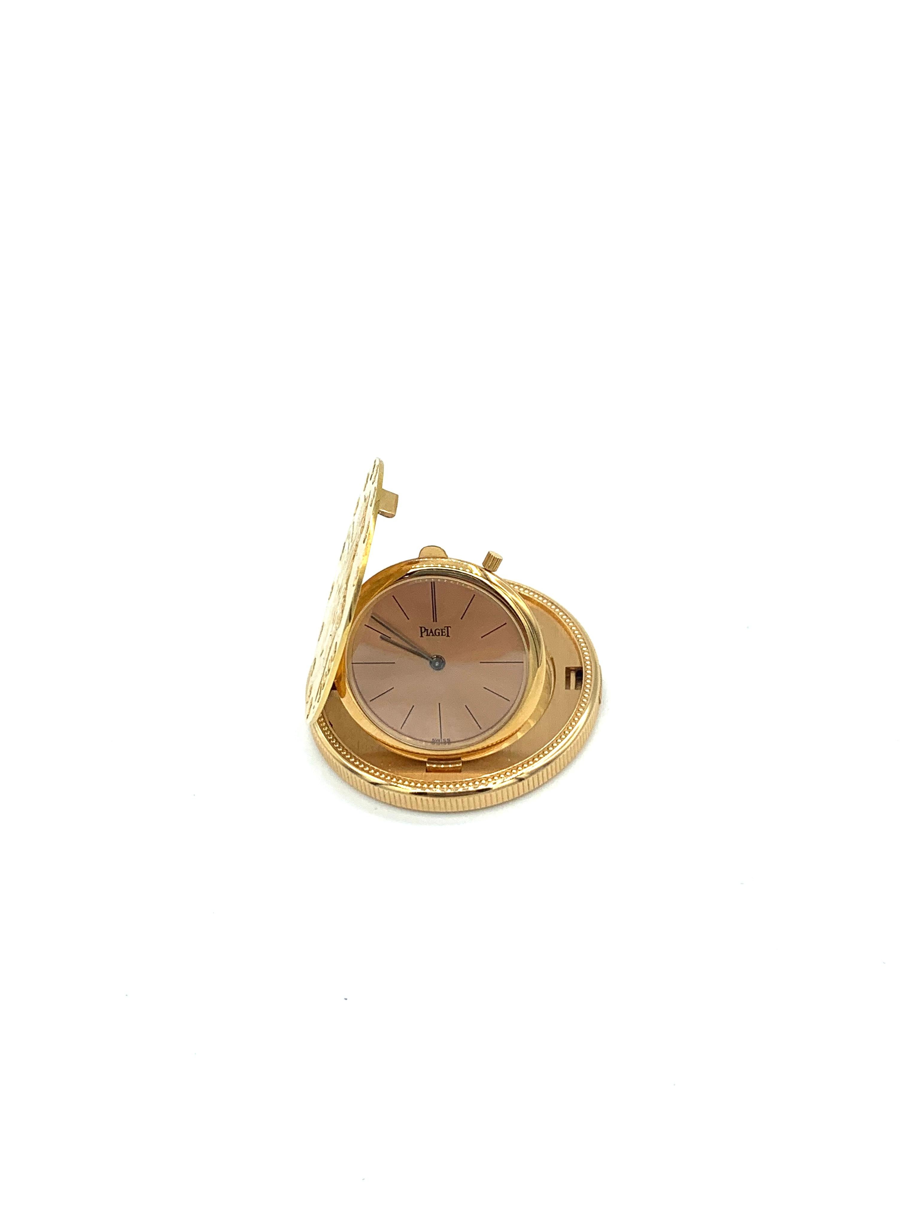 Piaget Pocket Watch. 18K Yellow Gold, 66 grams. Circa 1960. 1904 US  $20 gold piece cut in half, with a Piaget Swiss movement.   1 1/4 inches in diameter. Back of watch marked Piaget Swiss 18K 0.750, with 2 hallmarks. 2 additional hallmarks on