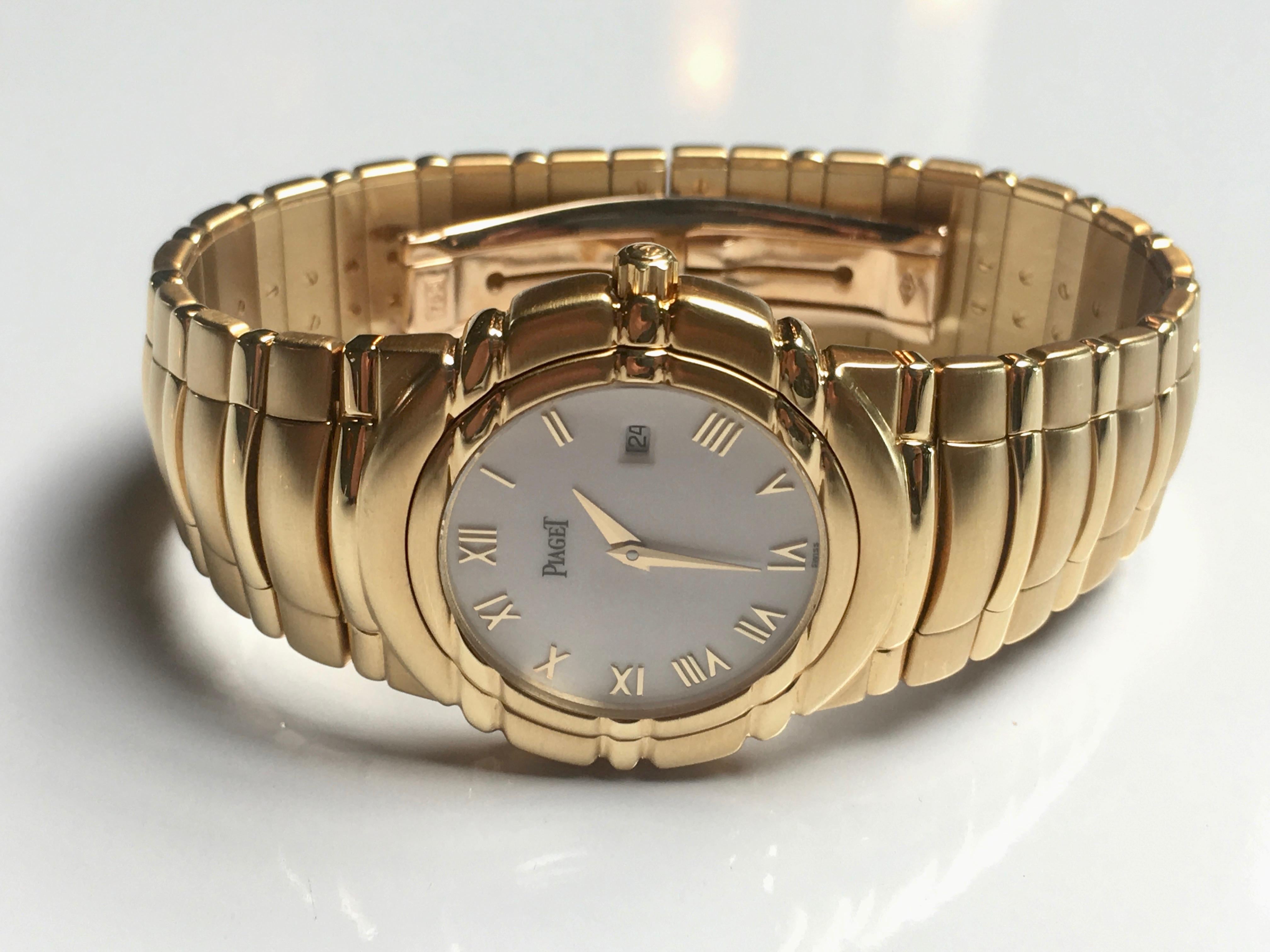 Gold Piaget Tanagra Midsize watch from 1993. Model 17141. 18K Yellow gold case and bracelet with hidden clasp, white Roman dial, quartz movement. 33mm, M 411D. Certificate of authenticity, with original purchase date and blue booklet. No box. Newly