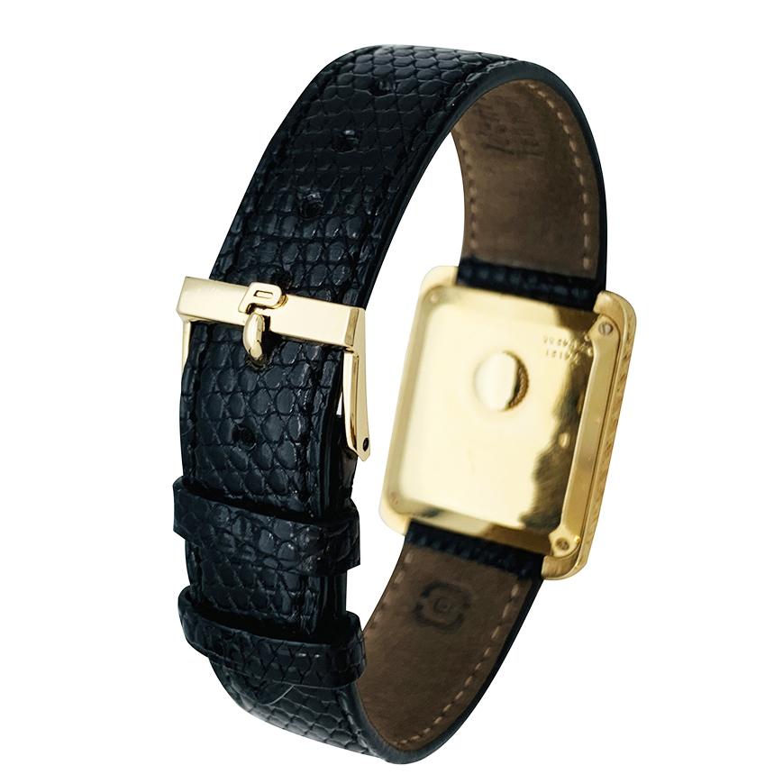 gold watch with leather strap