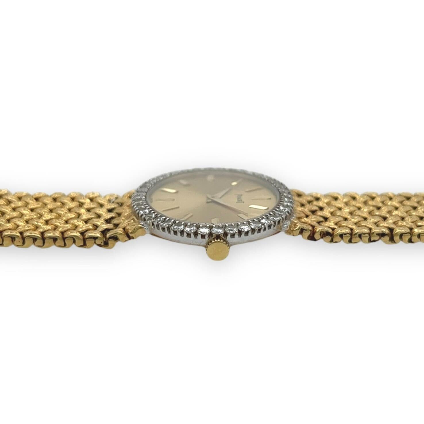 An 18 karat yellow and white gold and diamond watch, Piaget.  The manual movement watch with a horizontal oval dial of matte gold with polished gold baton hour markers, the bezel enhanced with forty (40) white gold set brilliant cut diamonds,