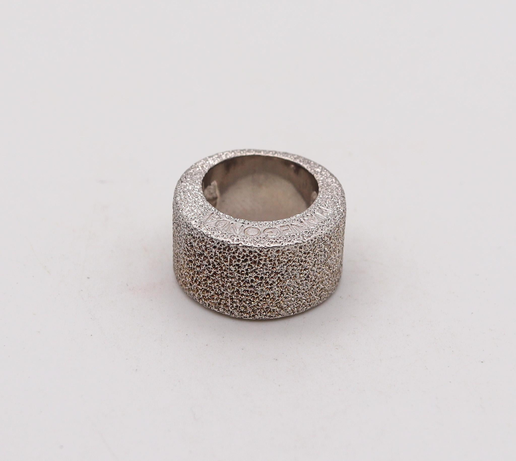 A textured band ring designed by Franco Pianegonta.

An unusual modernist band ring, created in Vicenza Italy by the jewelry house of Pianegonta. This ring has been crafted in solid .925/.999 sterling silver with textured finish. The jewelry pieces