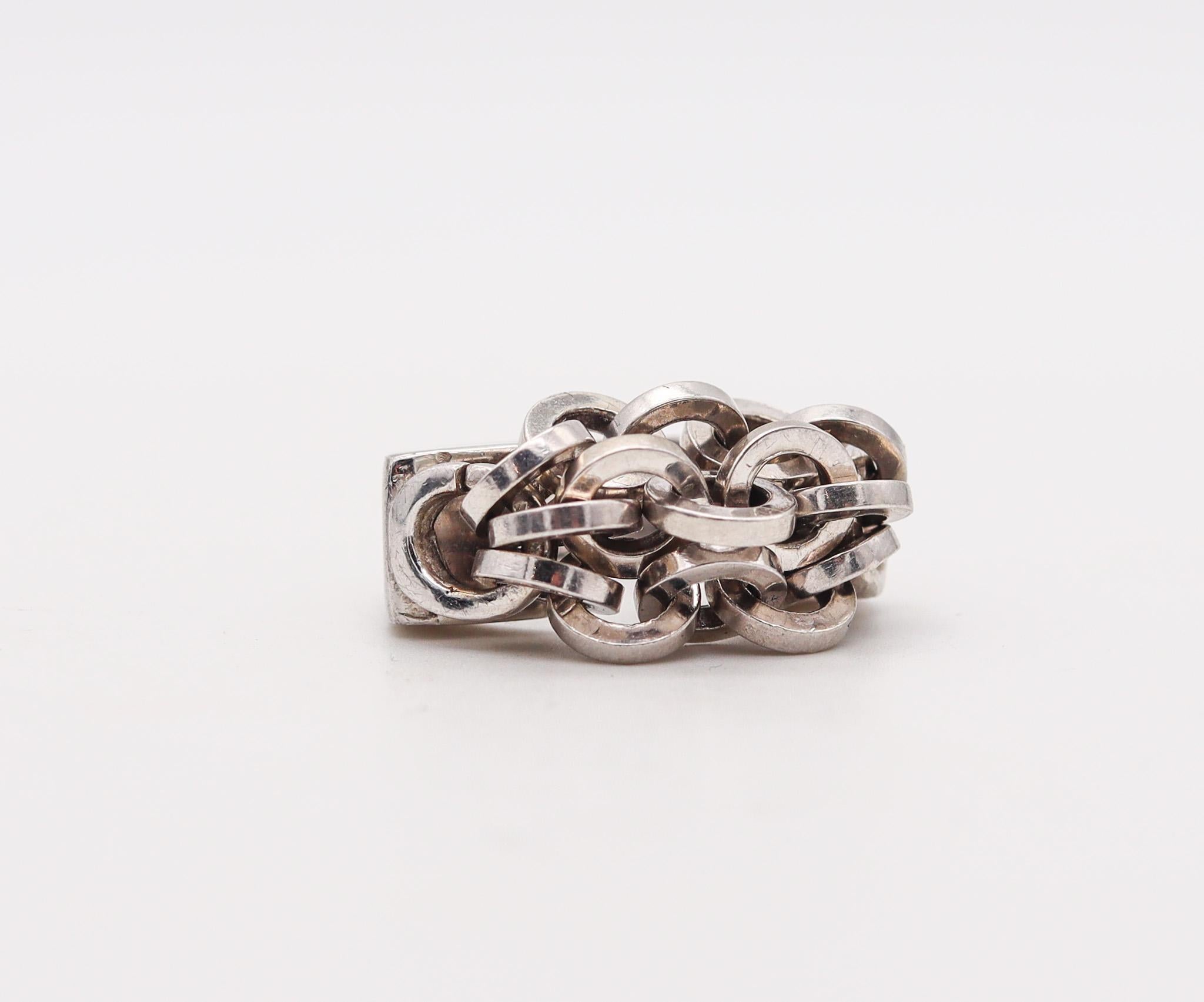A sculptural ring designed by Franco Pianegonta.

An unusual modernist cocktail ring, created in Vicenza Italy by the jewelry house of Pianegonta. This ring has been crafted in solid .925/.999 sterling silver with high polished finish. The jewelry