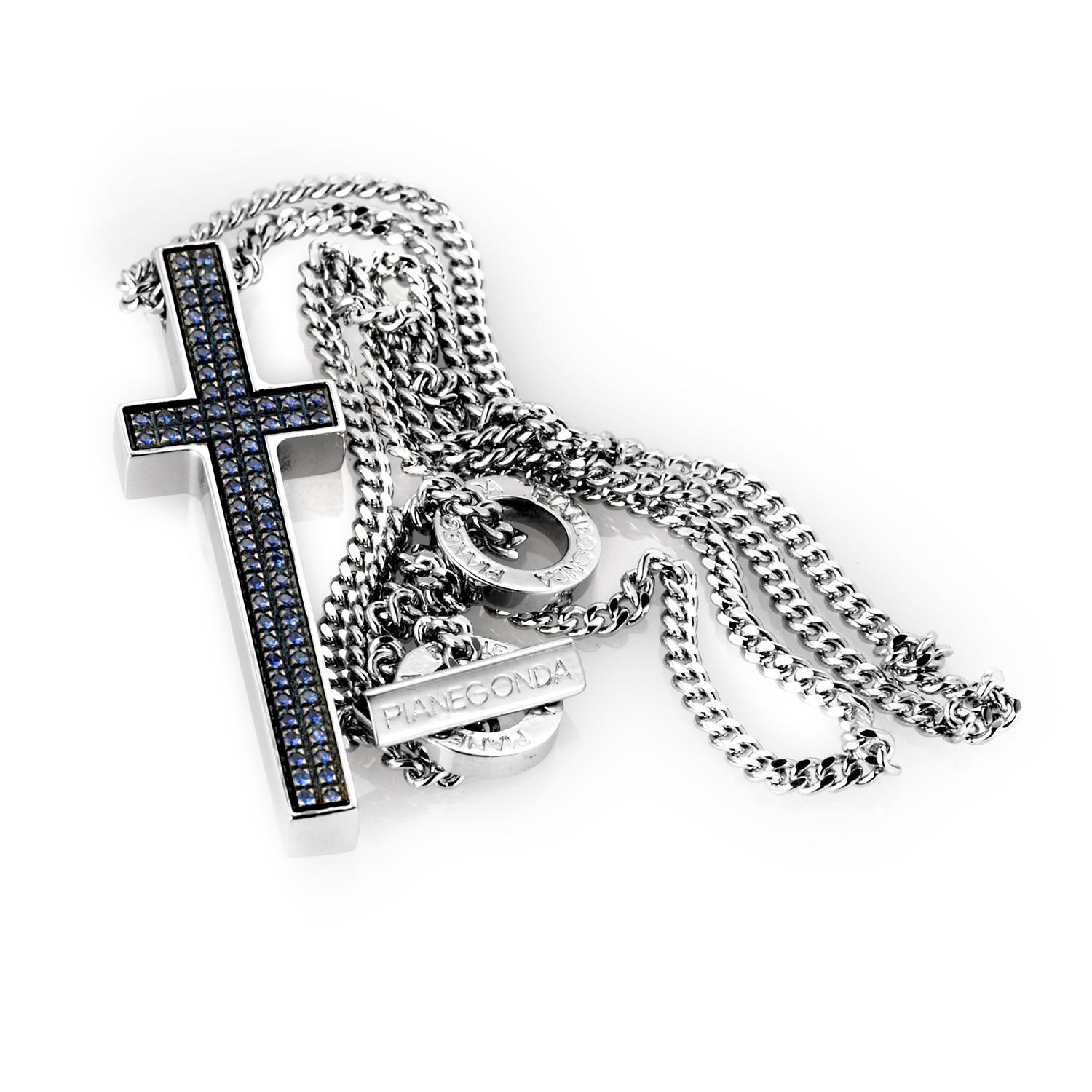 This pendant from Pianegonda is unique and an eye-catcher. It is made of silver and boasts a large hanging cross with a sapphire pave.
