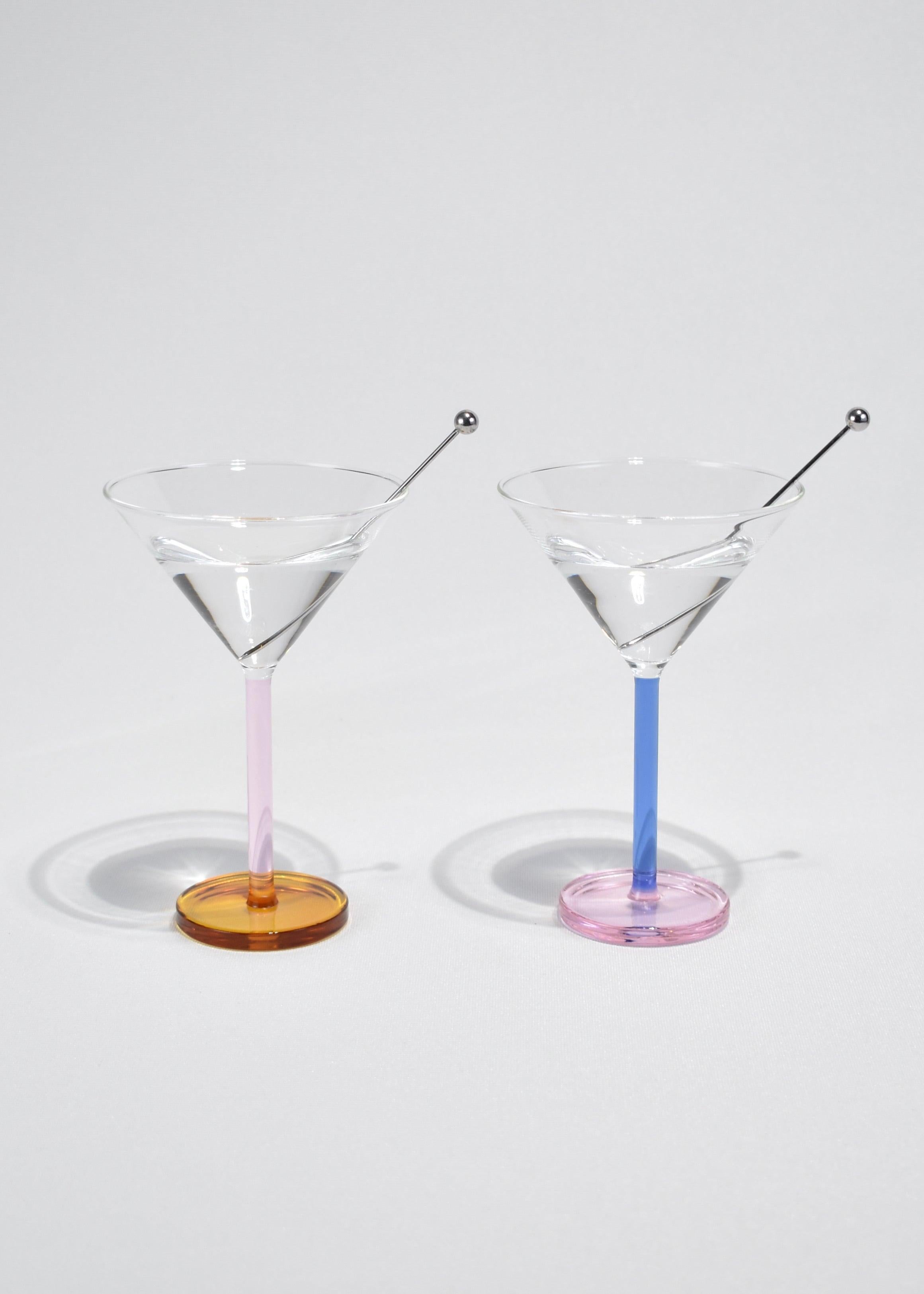 Colorful cocktail glass set of two with stainless steel garnish skewers. Designed by Sophie Lou Jacobsen in New York.

Made of lightweight and durable borosilicate glass. Cups are heat and cold resistant, and dishwasher safe. Each holds 3.5 oz. of