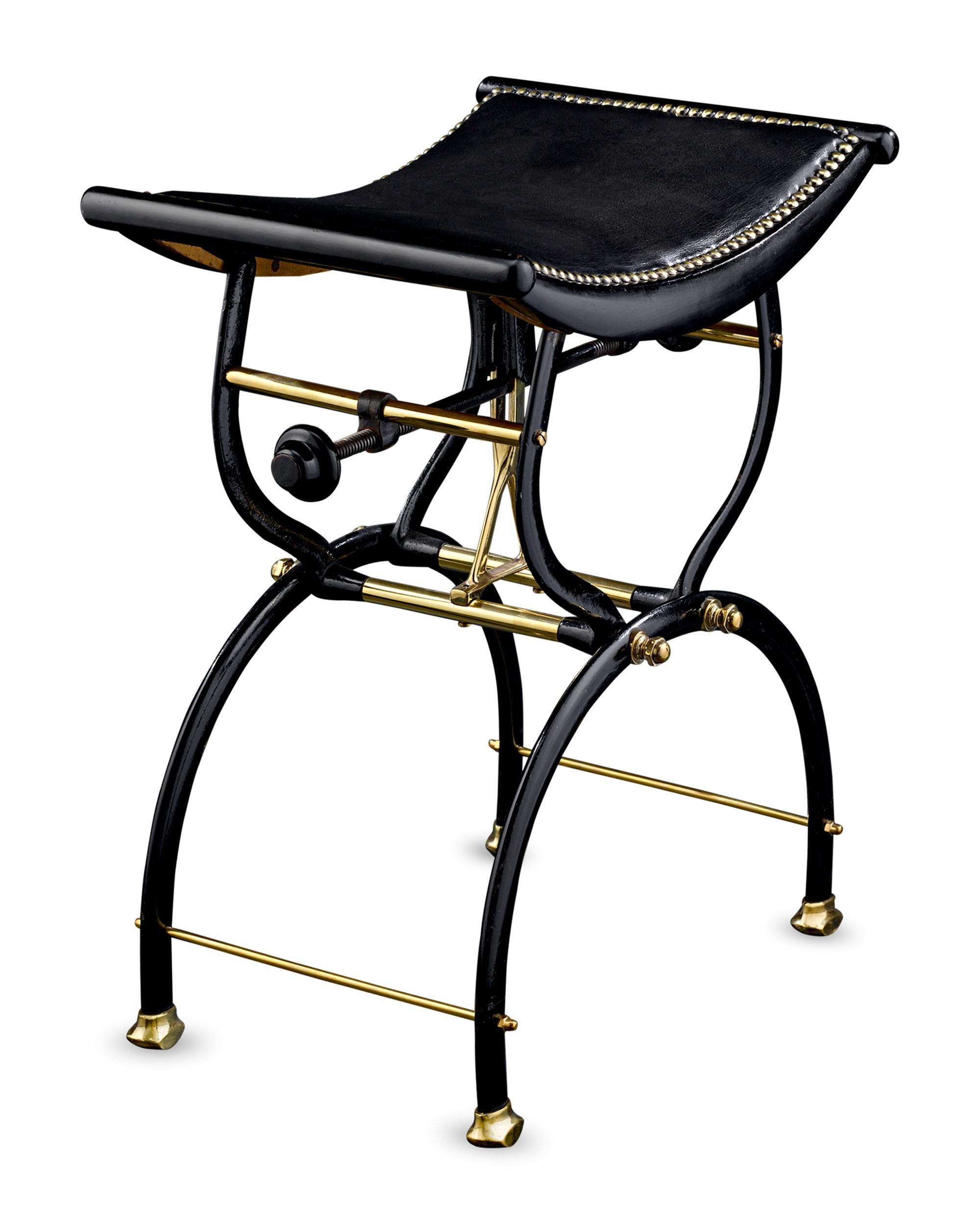 This late Victorian piano stool was created by the English firm of C. H. Hare & Son, which patented the base's unique X-frame design and crescent-shaped seat. Constructed of ebonized wood, cast iron and brass with an adjustable rise and fall