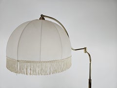 Gilt metal reading stand with adjustable arm 20th century