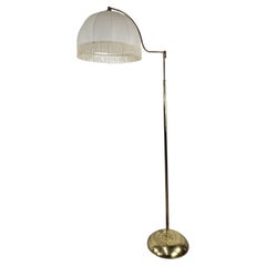 Gilt metal reading stand with adjustable arm 20th century