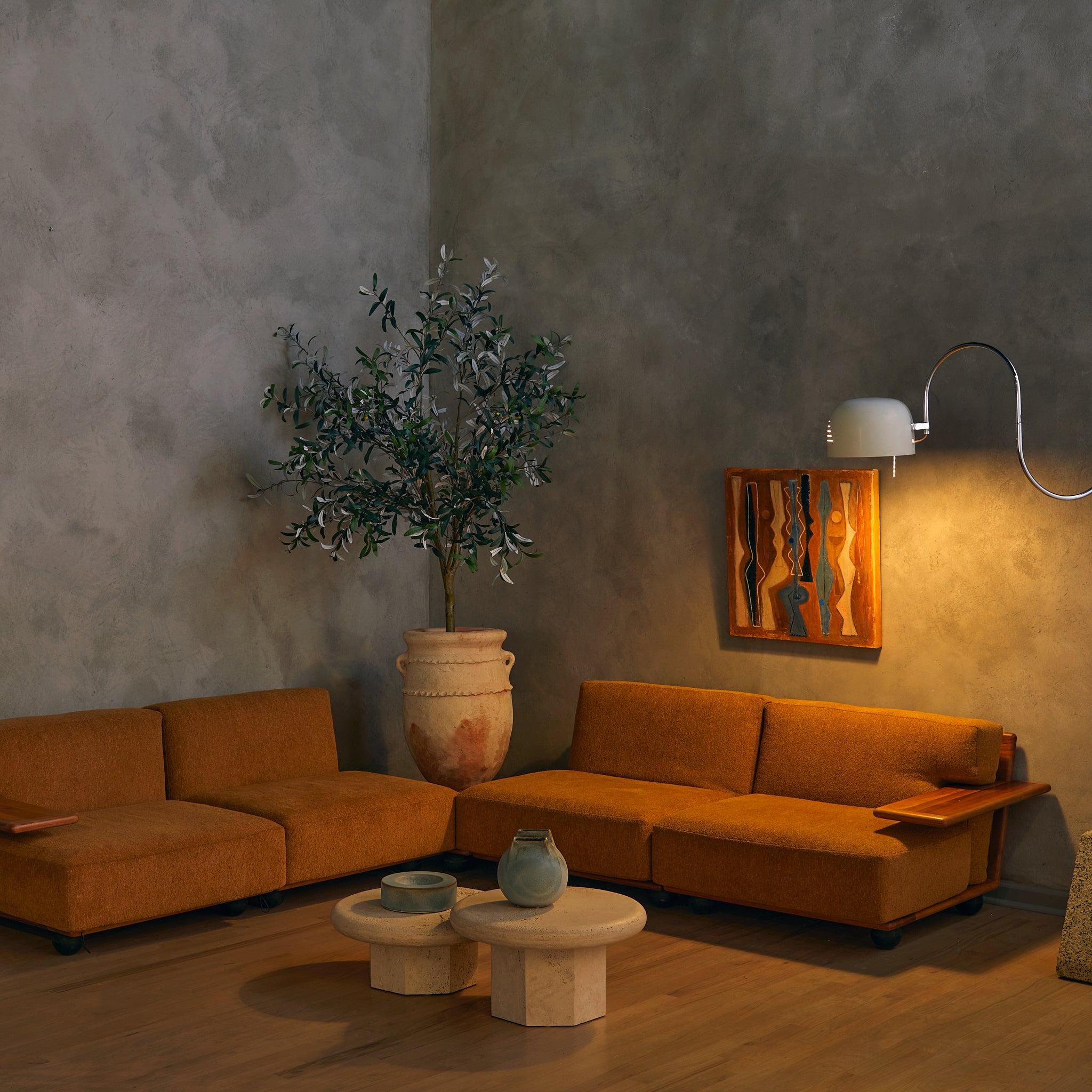 The ‘Pianura’ coffee table, designed by Mario Bellini for Cassina in 1972, takes its name from the Italian word for “flatland”—a fitting nod to its smooth, uninterrupted lines. Crafted from solid Italian walnut, its square silhouette, rich with