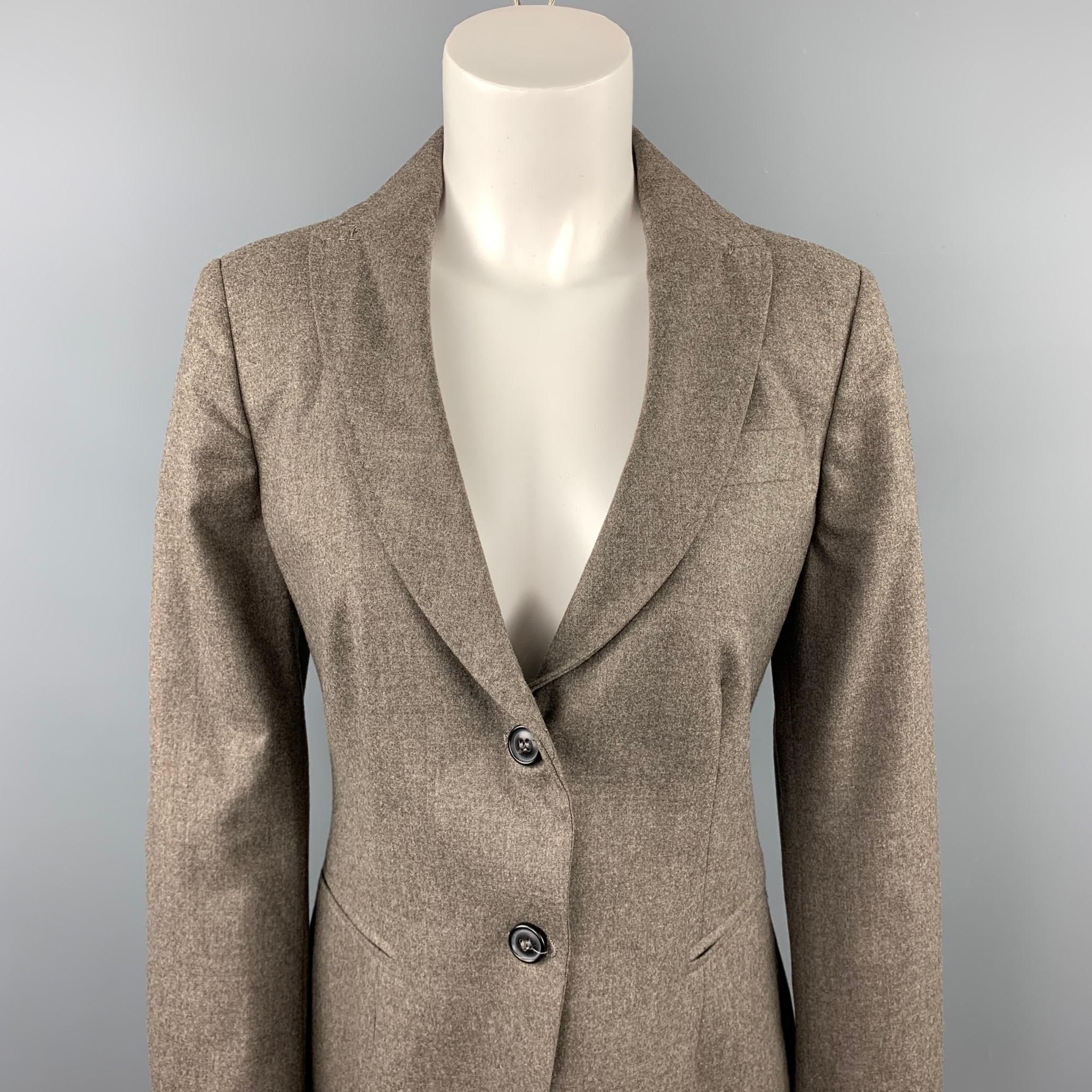 PIAZZA SEMPIONE blazer comes in a taupe wool blend featuring a notch lapel style, slit pockets, and a buttoned closure. Made in Italy.

Very Good Pre-Owned Condition.
Marked: IT 44

Measurements:

Shoulder: 16 in. 
Bust: 34 in. 
Sleeve: 25