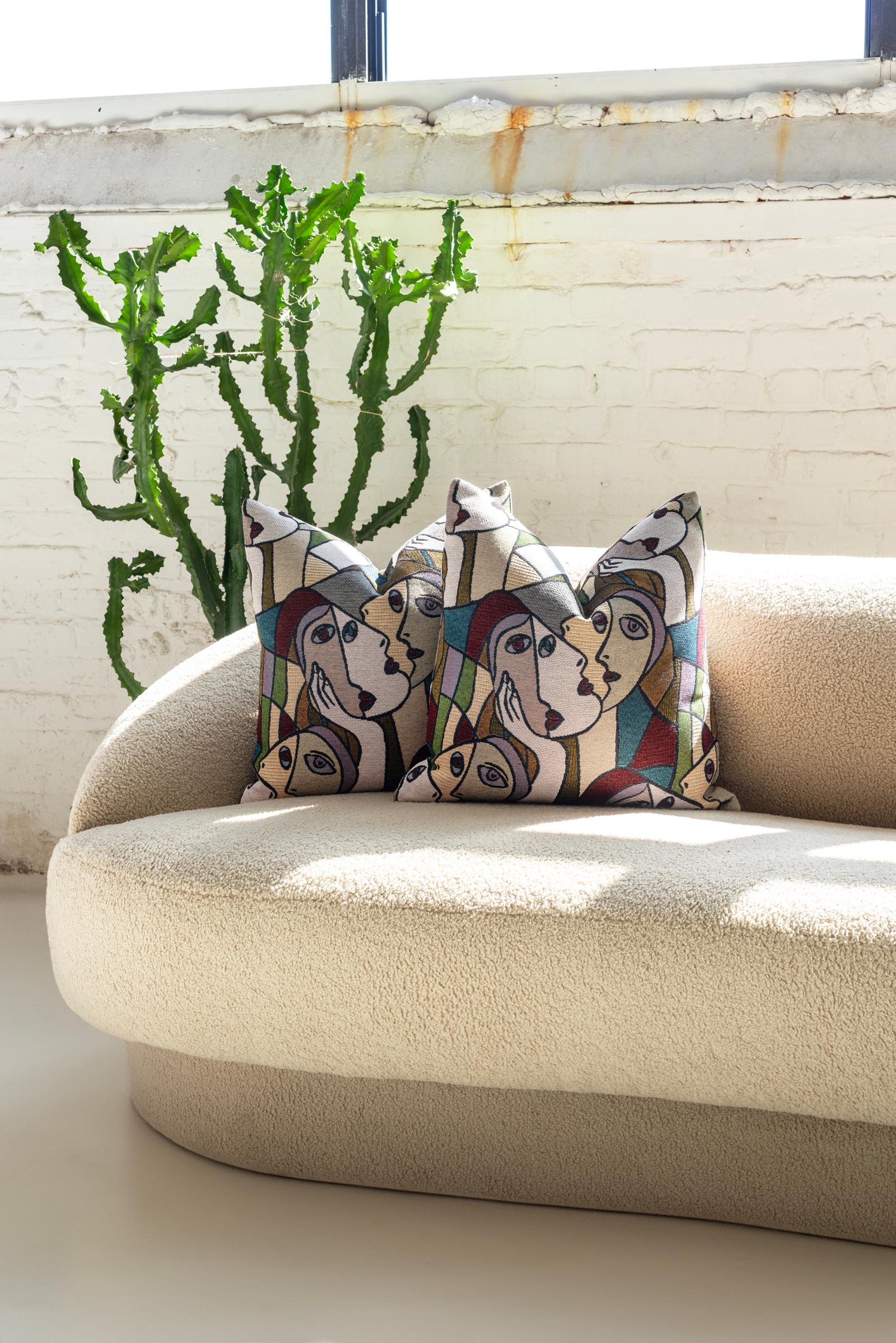 Discover a touch of artistic elegance and unparalleled comfort with this pair of down-filled throw pillows, handcrafted with meticulous attention in Chicago. These aren't just any throw pillows; each is a canvas for faces inspired by the iconic work
