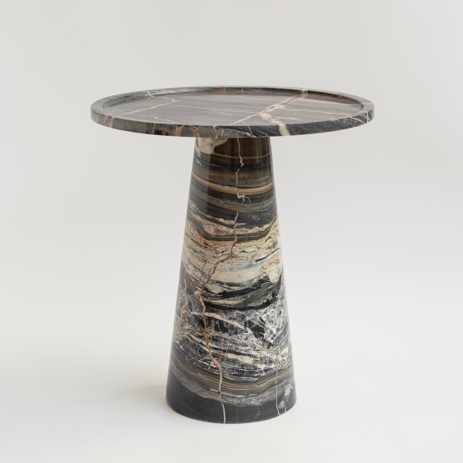 Stunning, aesthetic, timeless are words that can be used to describe this elegant and modern side table from Kiwano. Expertly crafted and finished by hand, our marble side tables are a study in sculptural simplicity. Natural variations in the