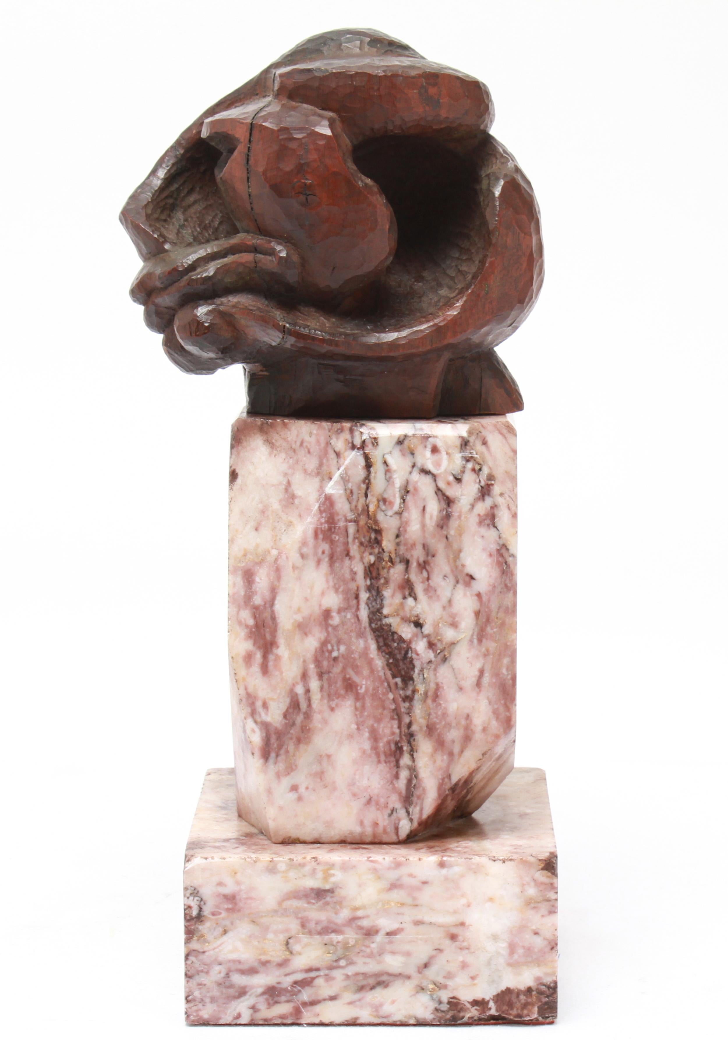 Modern abstract Cubist head sculpture bust in carved wood in the style of Pablo Picasso, atop a faceted marble base. The piece is in great vintage condition with age-appropriate wear.