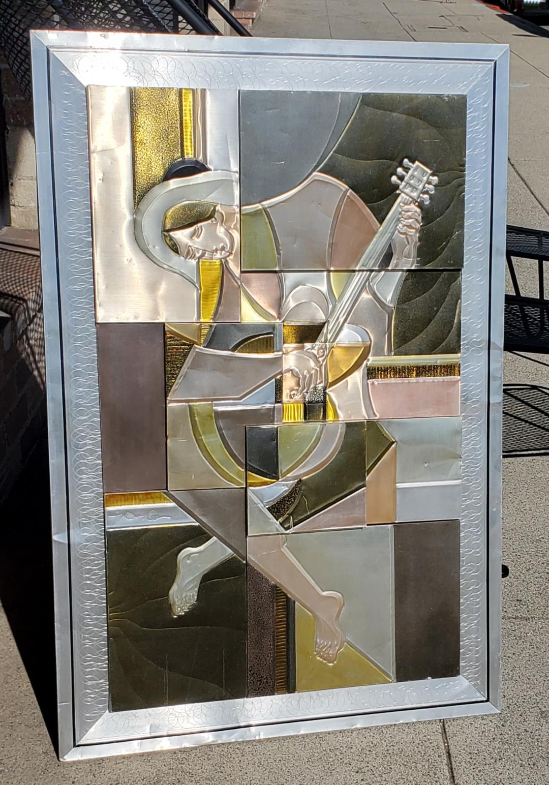 Picasso's Guitarist is rendered in a 3D embossed tinted aluminum metal sculpted Art Piece, Signed by Artist.

Picasso's 