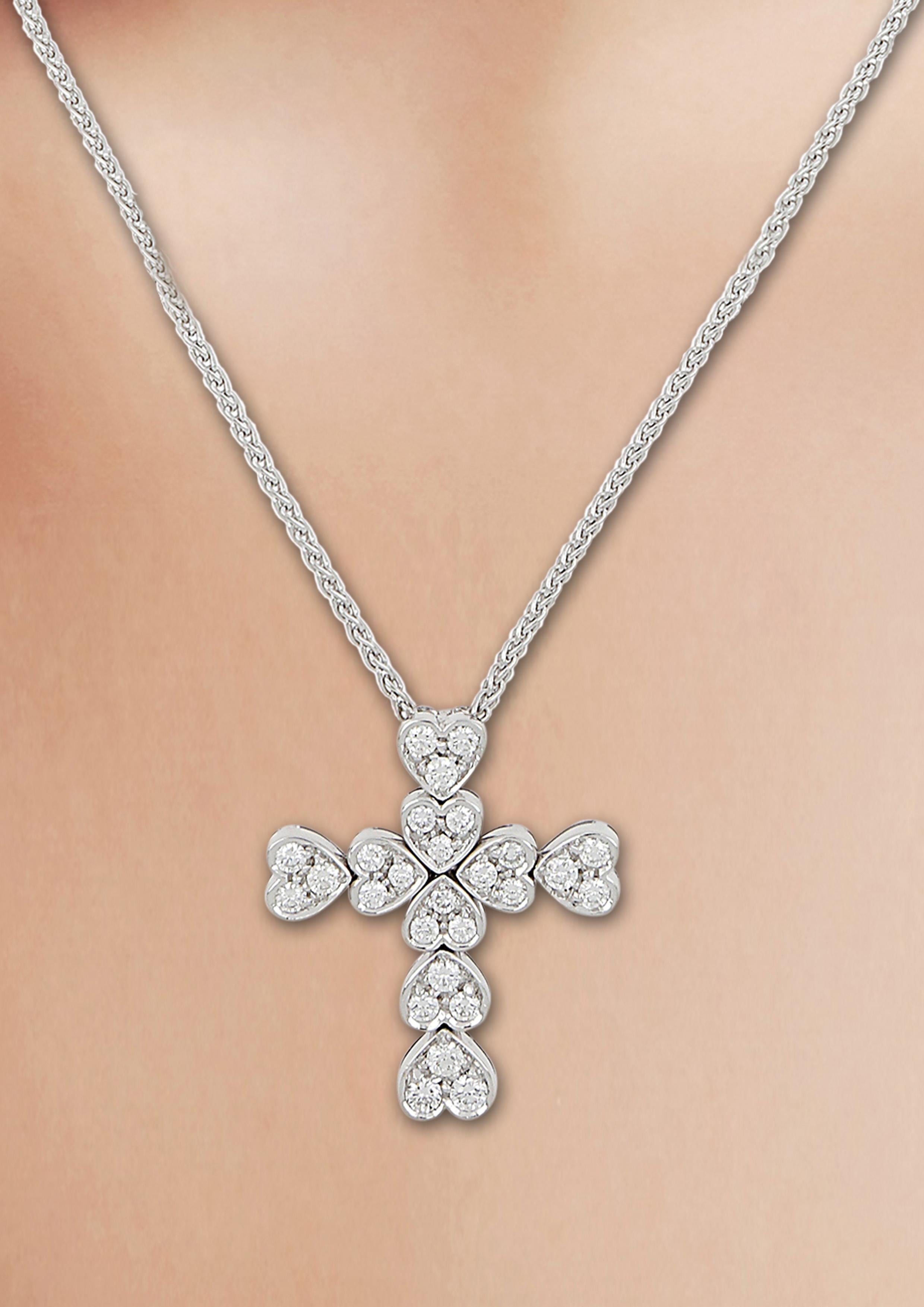 An unusual cross pendent where the four sections are made of delicate hearts each set with three diamonds.
Round Diamonds 0.74 carat - F/G color - VS clarity
Chain length 15-3/4 inches
Please note:
We do not ship to Japan.
USA: Shipping expenses and