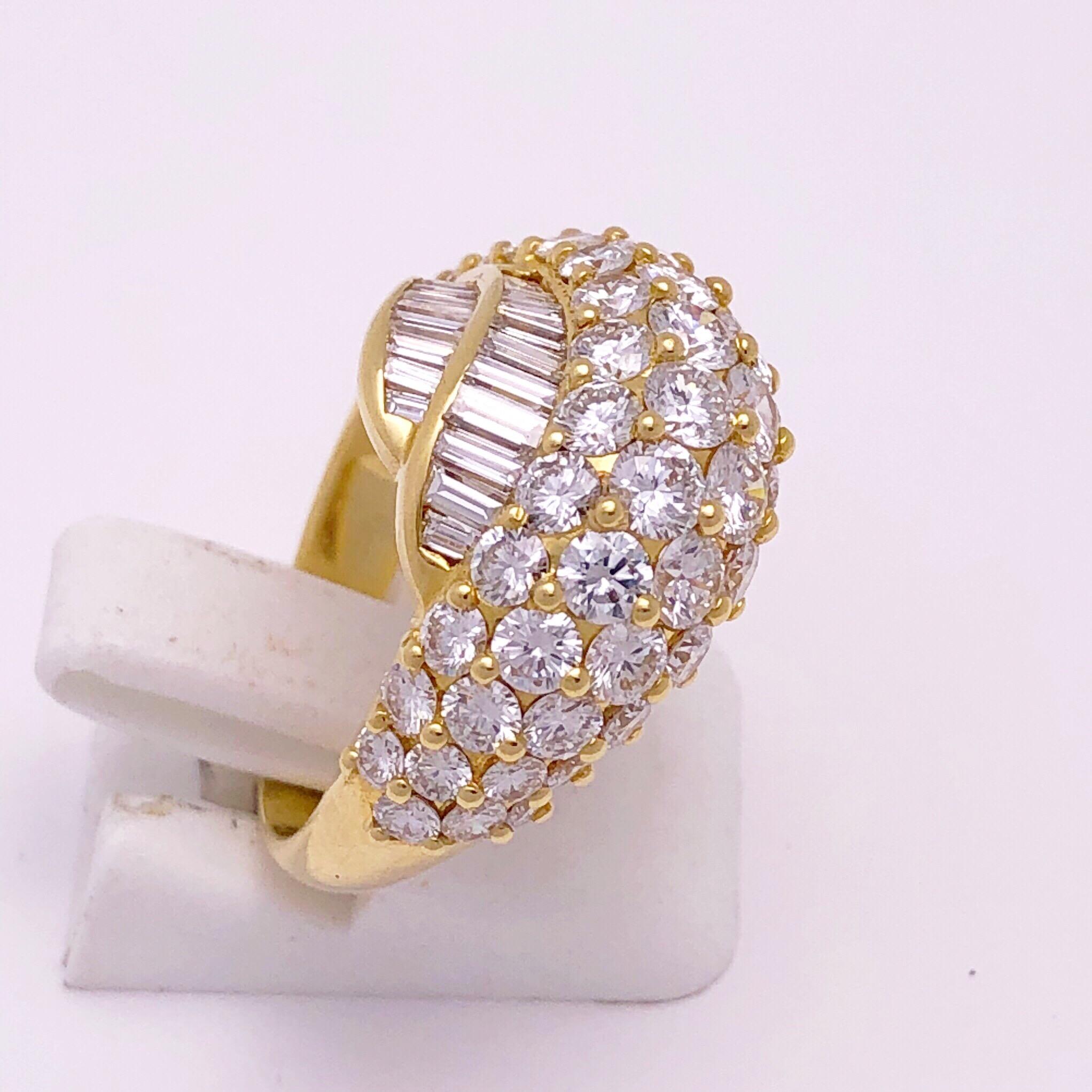 This gorgeous 18 KT yellow gold diamond ring is handcrafted by the renowned Italian designer Picchiotti.
This ring has been meticulously set with four rows of round brilliant cut diamonds weighing 3.25 carats and two rows of baguette cut diamonds