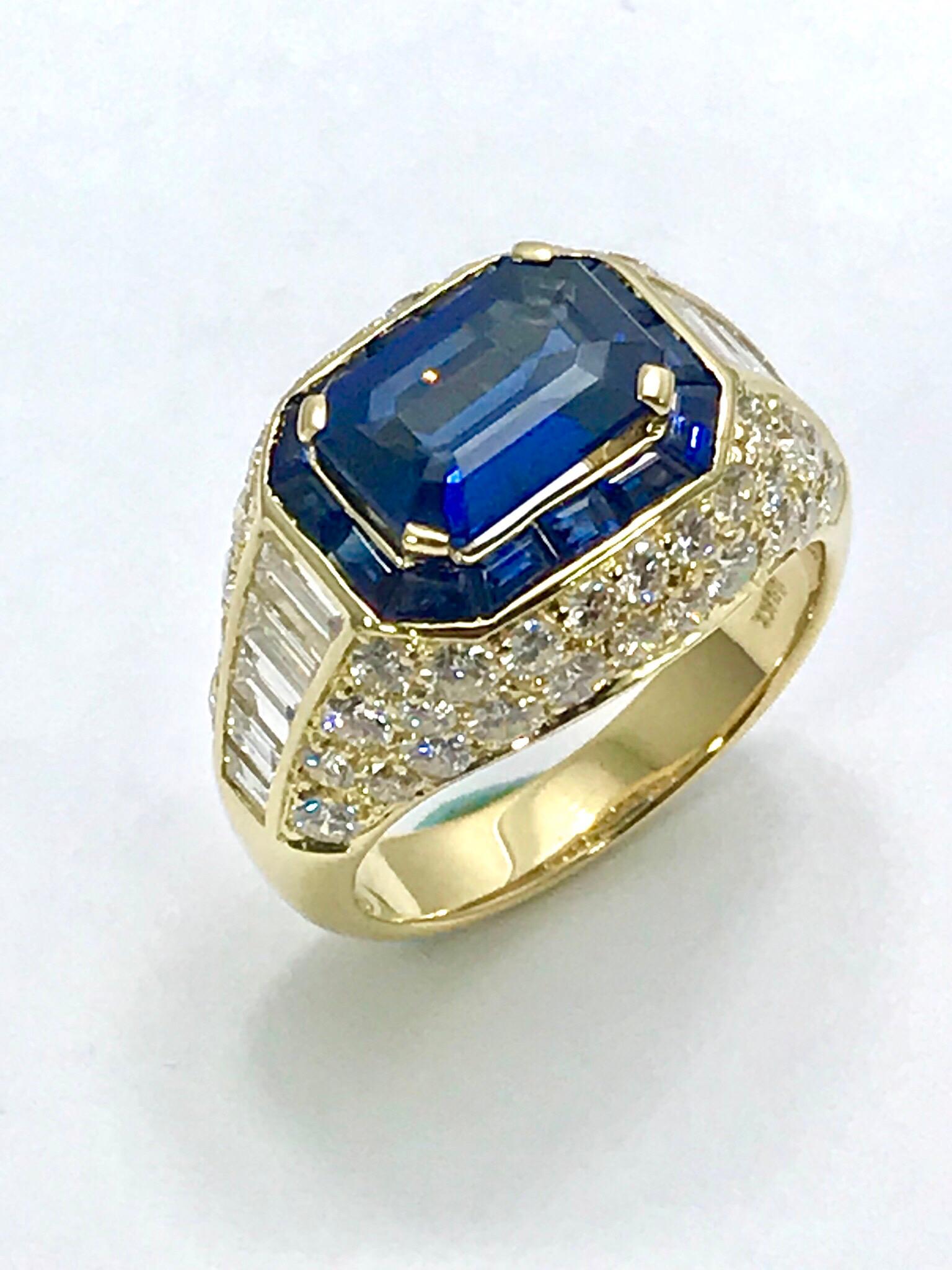 This is a stunning Picchiotti 2.48 carat emerald cut Sapphire and Diamond 18 karat yellow gold ring!  The center Sapphire is set with four prongs, framed by a single row of channel set Sapphires.  On either side of the center is a waterfall of