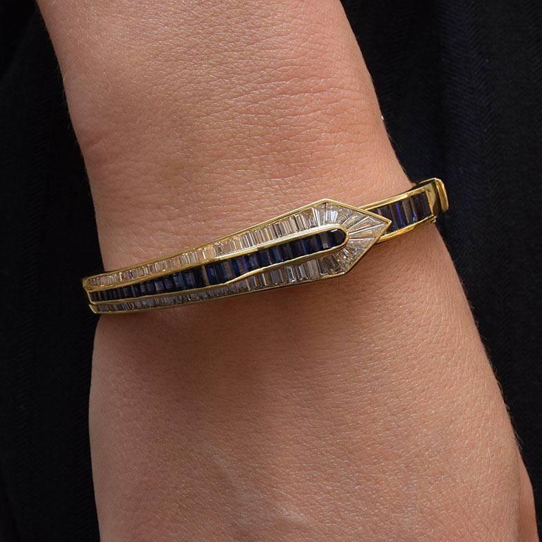 Picchiotti 18 Karat yellow gold bracelet is Invisibly set with 34 graduating baguette cut sapphires totaling 5.45 carats , and 4.18 carats of graduating baguette cut diamonds. 
Diamonds F/G color and VS Clarity. 
Piece comes fully appraised.