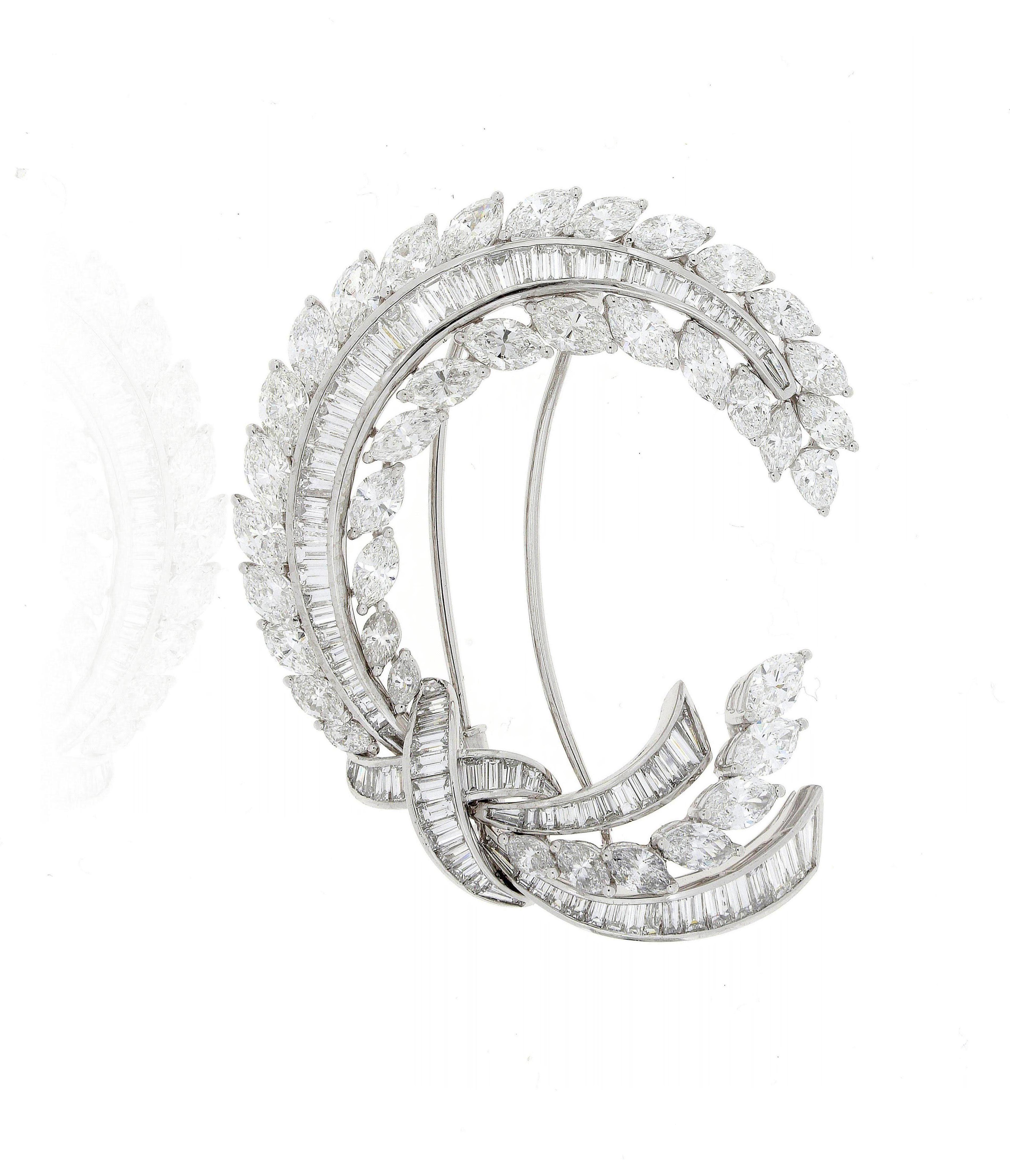 An Ear of Corn brooch, showing a perfect curving line of baguette diamonds, flanked on either side by a windswept row of marquise diamonds.
Marquise Diamonds 9.57 Carat  - F/G Colour - VVS Clarity
Pear-Shape Diamonds 0.19 Carat - F/G Colour - VVS