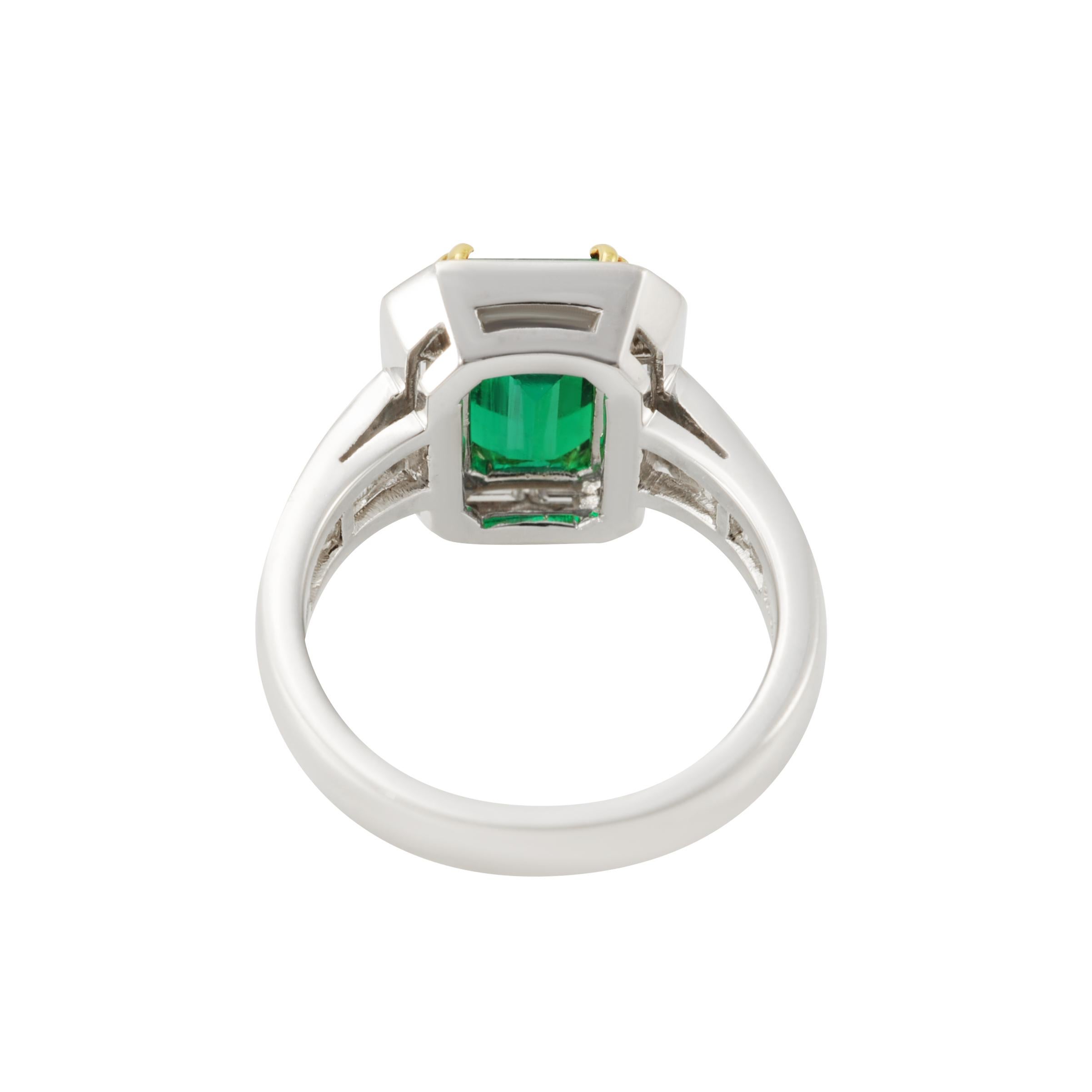 A fine octagonal emerald ring, its noble outline traced in baguette diamonds enriching the shank as well. 
Baguette Diamonds 1.82 carat Colour F-G / Clarity VVS
1 Octagonal Emerald 2.62 carat Gubelin Report: Origin Madascar 
US ring size 6-1/2
Each