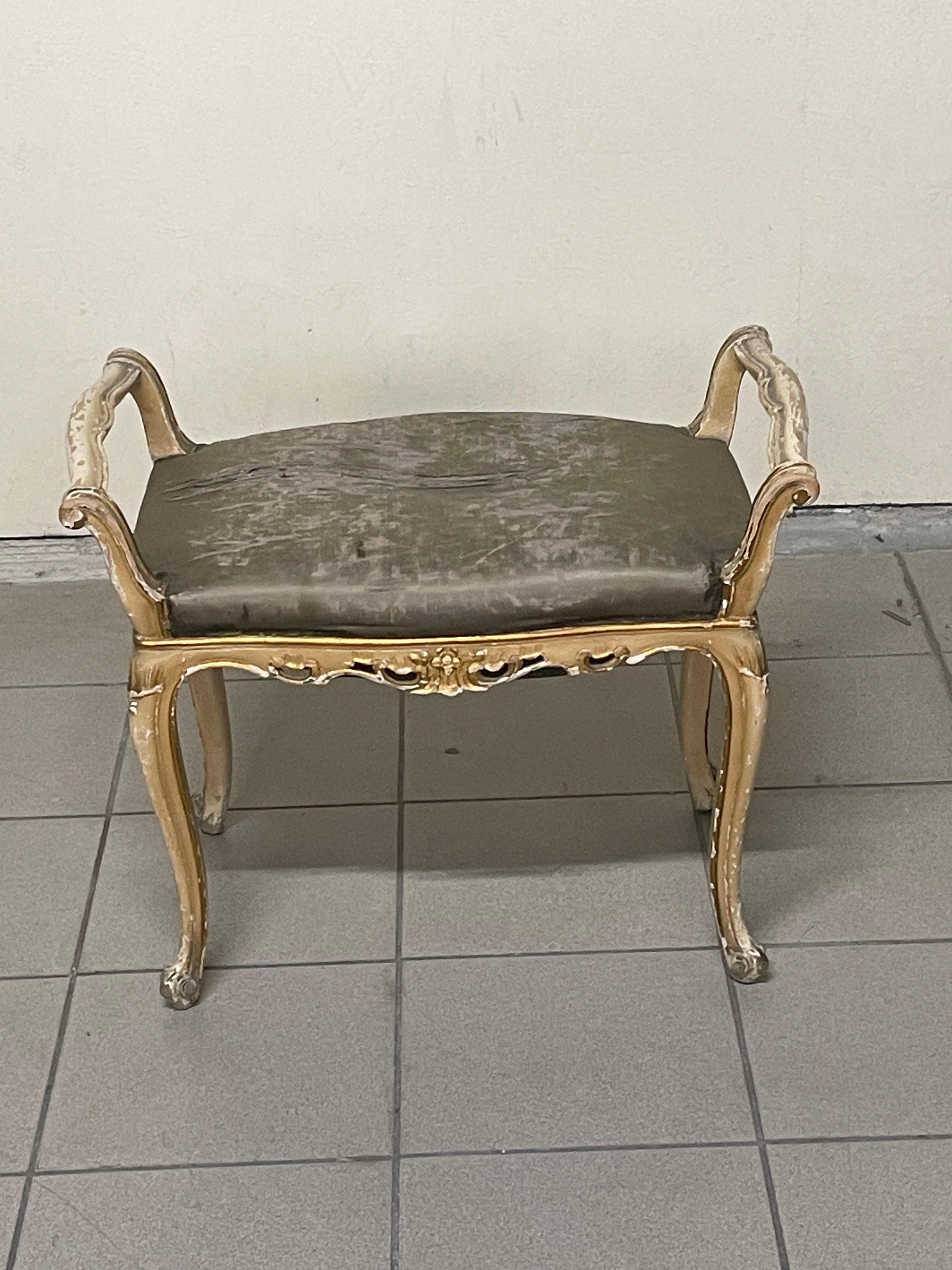 Small 1940s bench in the Louis XV style.

The bench has a lacquered and gilded wooden frame.
Fabric seat still original to be reupholstered.

The lacquering bears obvious signs of time, but these are to be left as they are; the padding and
