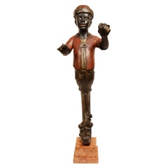 Small carved wooden figurehead depicting young Moretto Venice late 19th century